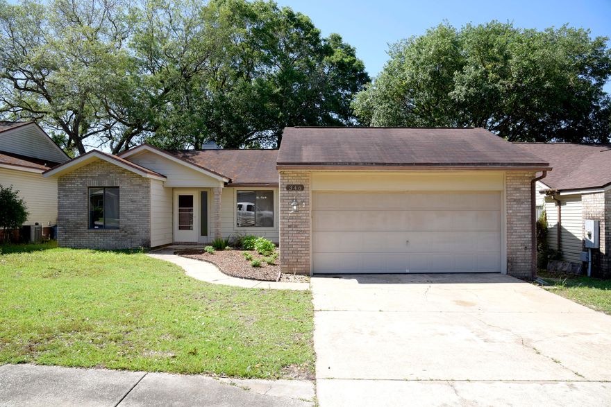 Fresh paint, new stainless appliances and new windows make this home move-in ready! A new roof will also be completed soon!  Enjoy the convenient location of this neighborhood which is close to schools and the hospital. This split bedroom plan has a master suite with adjoining bath and an open concept dining/great room featuring cathedral ceilings, a fireplace and laminate wood flooring.  Sliding glass doors access the screened porch and of course you'll love the eat-in kitchen with new appliances. Come take a look today!