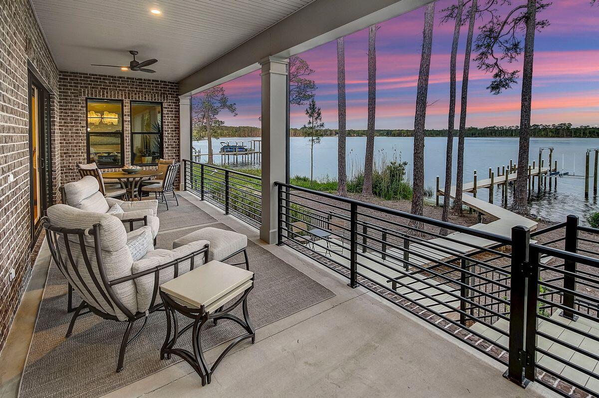 This waterfront home comes with its own dock and stunning views across the bayou to the wooded Fred Gannon Rocky Bayou State Park. It's a breathtaking location for enjoying an active outdoor lifestyle. Launch your boat from the boat lift and head off to Choctawhatchee Bay and the Gulf of Mexico or stay closer to home, kayaking and creek fishing. A private driveway leads to the two-car garage and attractive single-story home beneath a steep, pitched roof. The elevated footprint and newness of the property mean insurance costs are reasonable. The open floor plan maximizes natural daylight and delivers views from almost every corner. Wood flooring provides a transitional flow between the large living area with gas fireplace and the formal dining nook.