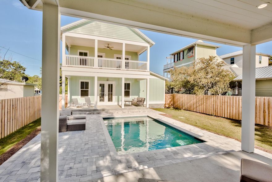 This custom built 3 bedroom and 3 bathroom Seagrove Beach house is being offered fully furnished and turn key. It has a private heated salt water pool with an open pool cabana (piped for gas and water as summer kitchen or for additional pool house as sewer is piped to structure for future use) as well as plenty of outdoor seating.  An open floor plan allows easy flow from pool to the gourmet kitchen featuring Thermador appliances and tile backsplash. The ground floor has one bedroom as well as 180 additional square feet of garage storage space.  This could be perfect for golf cart or easily converted to bunk room, office, etc.  Upstairs you find additional flex space that can be extra living room, office or sleeping area.. The master bedroom has large porch overlooking pool oasis.