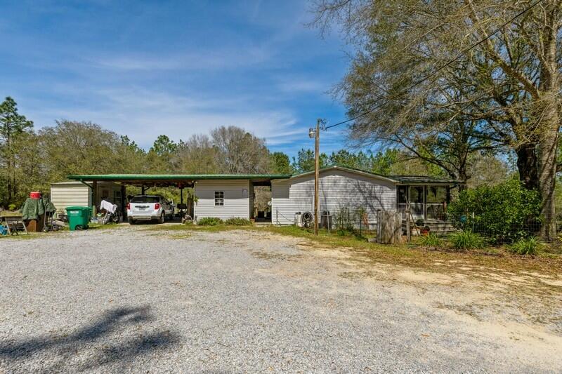 IF YOU ARE LOOKING FOR PRIVACY, THIS IS THE HOME FOR YOU! Owner has taken good care of this home and there are 4.75 acres of land to enjoy. All appliances will stay with home, there is an above ground pool to enjoy in the summer time! New A/C, dishwasher 5 years old. Gun range, lots of flowers and trees, deer drop by to see what is going on! This is an OLDIE but GOODIE! Owners have enjoyed living in this home and area. No problems at all. There are two other buildings for storage or workshop would work as well. Chelco power, Auburn waterCheck out this desirable home! So quiet and so pleasant. Lots of trees. OOps, there is a screened front porch to enjoy also!!