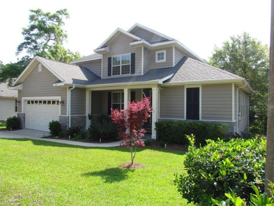 ''This Keylime built beauty is Conveniently located in Rockywood Subdivision near Eglin and within walking distance to the Crossing shopping center.Nestled on Beaver Creek in quiet, Sit on your screened patio and enjoy the view overlooking nature at its finest.'' Gorgeous wood laminate flooring and tile throughout the home. Kitchen with a center island , stainless appliances, built in microwave and smooth top stove all open to a spacious living room with fireplace. Master suite located on main level and provides tray ceiling, jetted garden tub, separate stand up shower, double vanity and HUGE walk in closet. Additional bedrooms located upstairs, one is a mini suite with its own full bath attached. Windows equipped with custom blinds and laundry room is spacious with loads of cabinets.