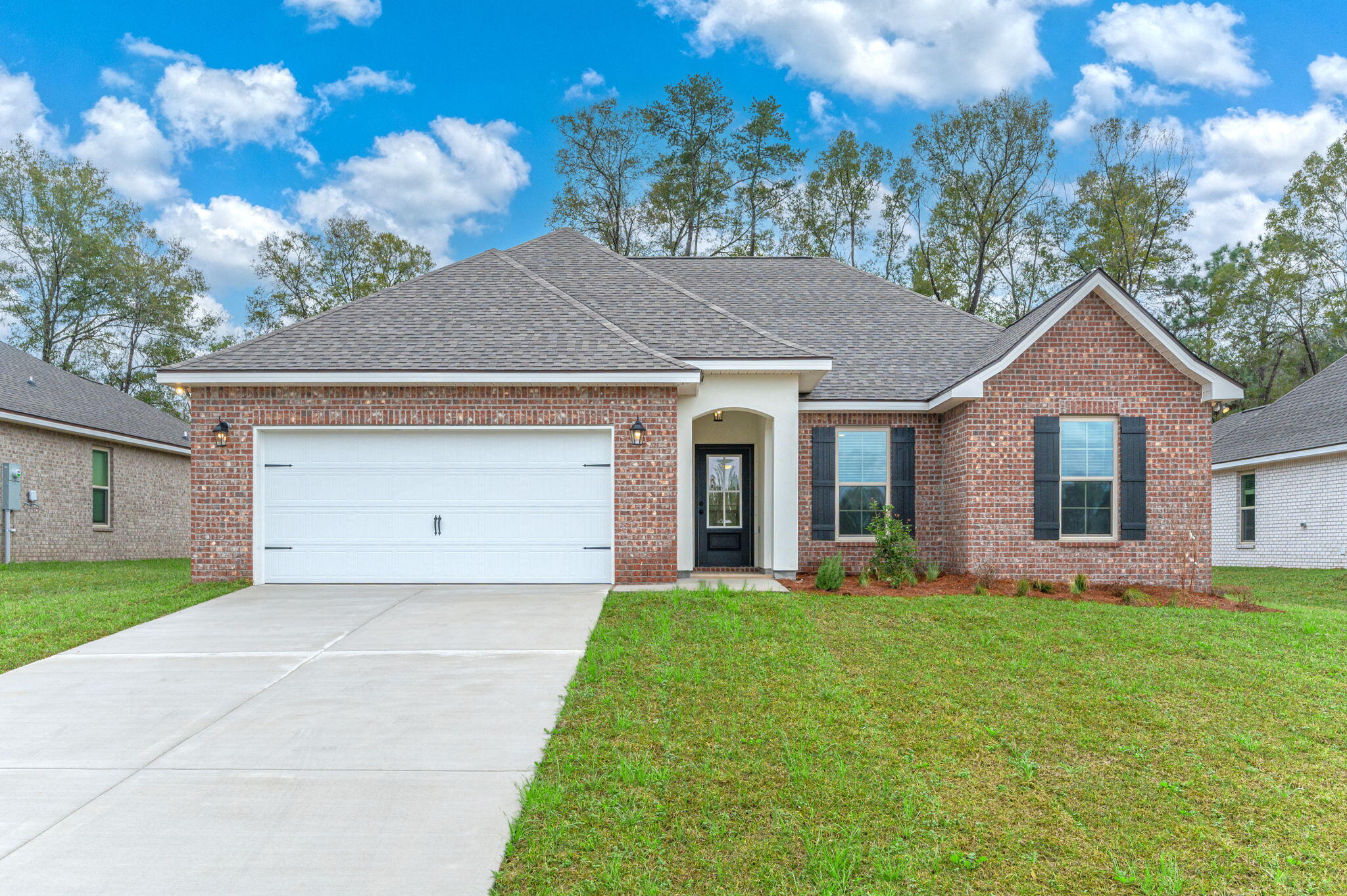 Awesome builder rate plus FREE front gutters. Restrictions apply.The RAVENSWOOD V B in Young Oaks community offers a 4 bedroom, 2 full bathroom, open design. Upgrades added (list attached).Features: double vanity, garden tub, separate shower, and 2 walk-in closets in master suite, kitchen island, covered front porch and rear patio, crown molding ceiling fans in living room and master bedroom, smoke and carbon monoxide detectors, landscaping, architectural 30-year shingles, flood lights, and more!Energy Efficient Features: water heater, kitchen appliance package with a electric range, vinyl low E MI windows, and more! Energy Star Partner.