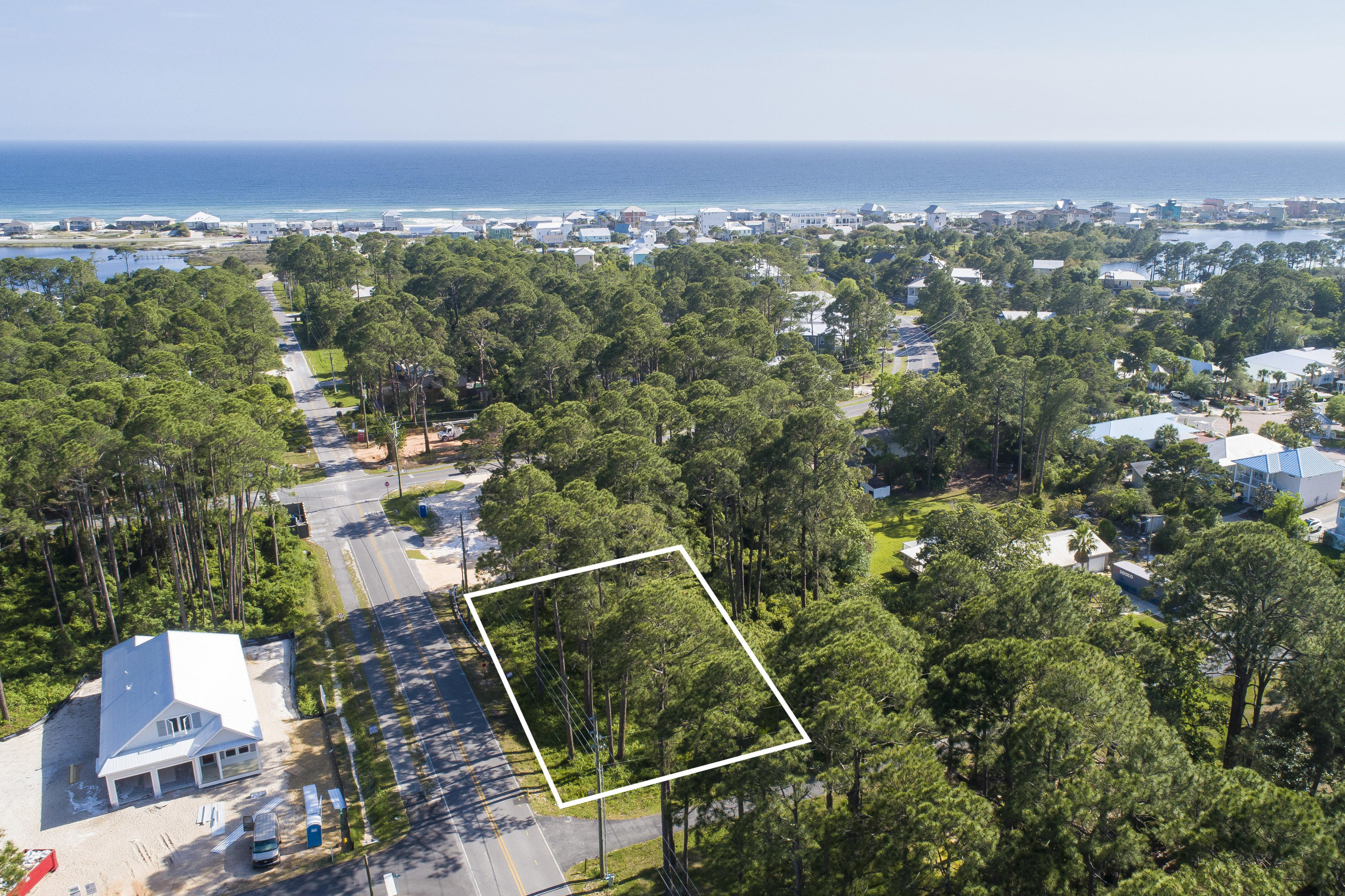 Large corner lot in Dune Allen Beach area. Build your beach home and enjoy the Good Life of 30-A. Close to shopping, two public beach access'es, Santa Rosa Golf Club, Great schools and Sacred Heart Hospitals. This lot is partially cleared with some remaining pine tree's.