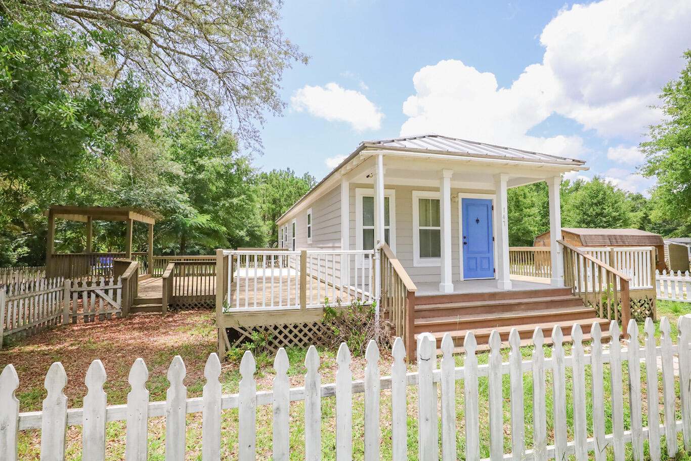 Adorable Florida Cottage with an expansive open deck wrapping around 3 sides of the home extended with a pergola on the south side of the home. Featuring crown mounding, granite countertops, and LVP flooring. Built strong to withstand 165 mph winds, with double-pane windows, metal roof, Hardie board siding, extra insulation for energy efficiency. The home has been part of a rental portfolio generating $1675/monthly. Located 15 miles from the pristine beaches of Florida's Emerald Gulf Coast and only 6 miles to Grady Brown Park & boat launch!