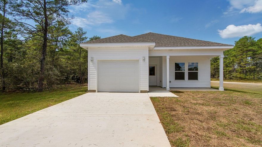 Beautifully crafted new construction home by Southern Home Solutions, a trusted local builder known for quality craftsmanship. This 3-bedroom, 2-bath home with a 1-car garage features an open and inviting layout with 9-foot ceilings, wall-to-wall LVP flooring, and ceiling fans in every room. The kitchen shines with quartz countertops and modern finishes, perfect for both everyday living and entertaining. Located in Flood Zone X, this home offers peace of mind and long-term savings. Enjoy the added confidence of a 1-year builder's warranty. Ideally situated just minutes from shopping, interstate for easy commute to neighboring cities,  beaches, the Springs, and the newly opened Shoal River Headwaters State Park.