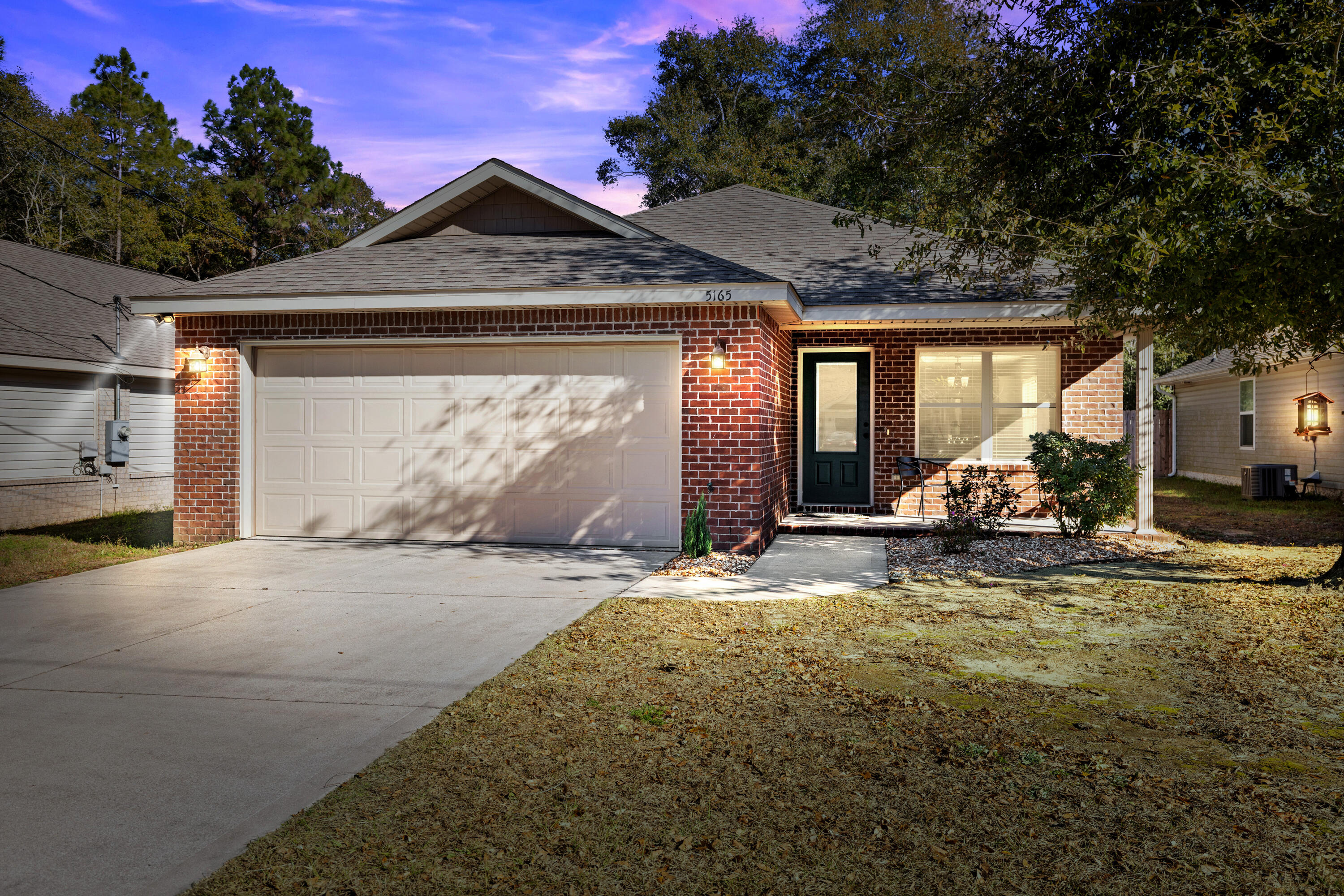 Welcome to your dream home in South Crestview built in 2017 with a .71-ACRE LOT and a stream located at the rear of the property. Enjoy LOW Homeowners Insurance at $1261 a year! This brick home offers ample space featuring 3 bedrooms and 2 baths, the open floor plan is perfect for modern living. The stylish kitchen boasts elegant white cabinets, stainless steel appliances, a breakfast bar accommodating three stools, a pantry, and a dining area ideal for get togethers. The spacious Master Bedroom is complemented by a Master Bathroom with double vanities, separate his and her walk-in closets, a linen closet, and a convenient tub/shower combo. Enjoy the beauty of LVP flooring throughout, with tile flooring in the kitchen and baths for easy maintenance. Step outside to the inviting screened- in covered back porch for morning coffee or to watch the sunset leading to a private backyard oasis. The backyard is enclosed on both sides, leaving the rear open to a wooded area perfect for fun and exploration. Come take a look at this beauty today. Easy commute to Duke Field, 7th Special Forces, Eglin AFB, schools, restaurants and shopping. **The virtual tour doesn't include the newly fenced and cleared backyard**