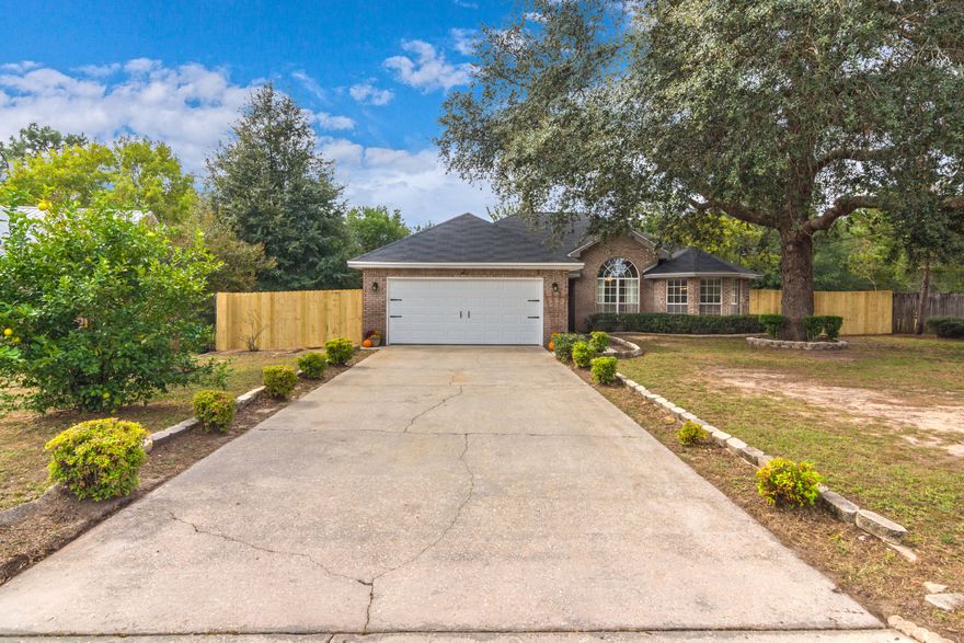 BACK ON THE MARKET due to no fault of the sellers! South of I-10 location! All brick beauty, split floor plan offers opening living area, fire place, formal dining w/cathedral ceiling and large window adds character & elegance, Kitchen has tile, stainless steel appliances, lots of cabinets, pantry and pretty bay window. Spacious Master bedroom has raised ceiling, Master bath offers separate shower, double vanities and garden tub. Yard is large and level, county location means lower taxes too! Absolutely, positively, must see!