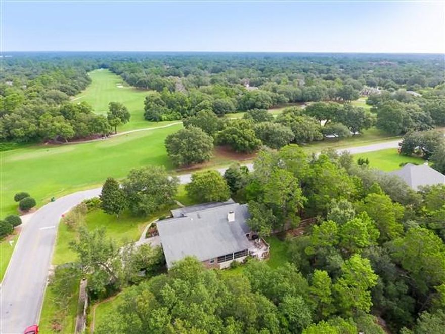 LOTS OF LIVING SPACES,RENOVATED KITCHEN & BATHS AND PRIVATE .98 ACRE LOT SET THIS HOME ASIDE. This home's bonus room, 4th bedroom, 440 SF screened porch & cooled workshop provide plenty of space for offices, craft,exercise or play rooms. You'll love the new kitchen w/custom ceiling height cabinets, SS appliances, 1 yr refrigerator, pot filler, beautiful granite counters & pantry. Relax in the remodeled master bath w/granite topped his & her sinks, jetted tub, walk-in shower & large walk-in closet. A brand new HVAC w/new duct work, 11 year roof & hurricane protection for all windows but 1 provide peace of mind. Other features include newer laminate wood flooring throughout, high effic windows,yard bldg & fireplace. The spacious screened porch, back deck & large private fenced yard provide