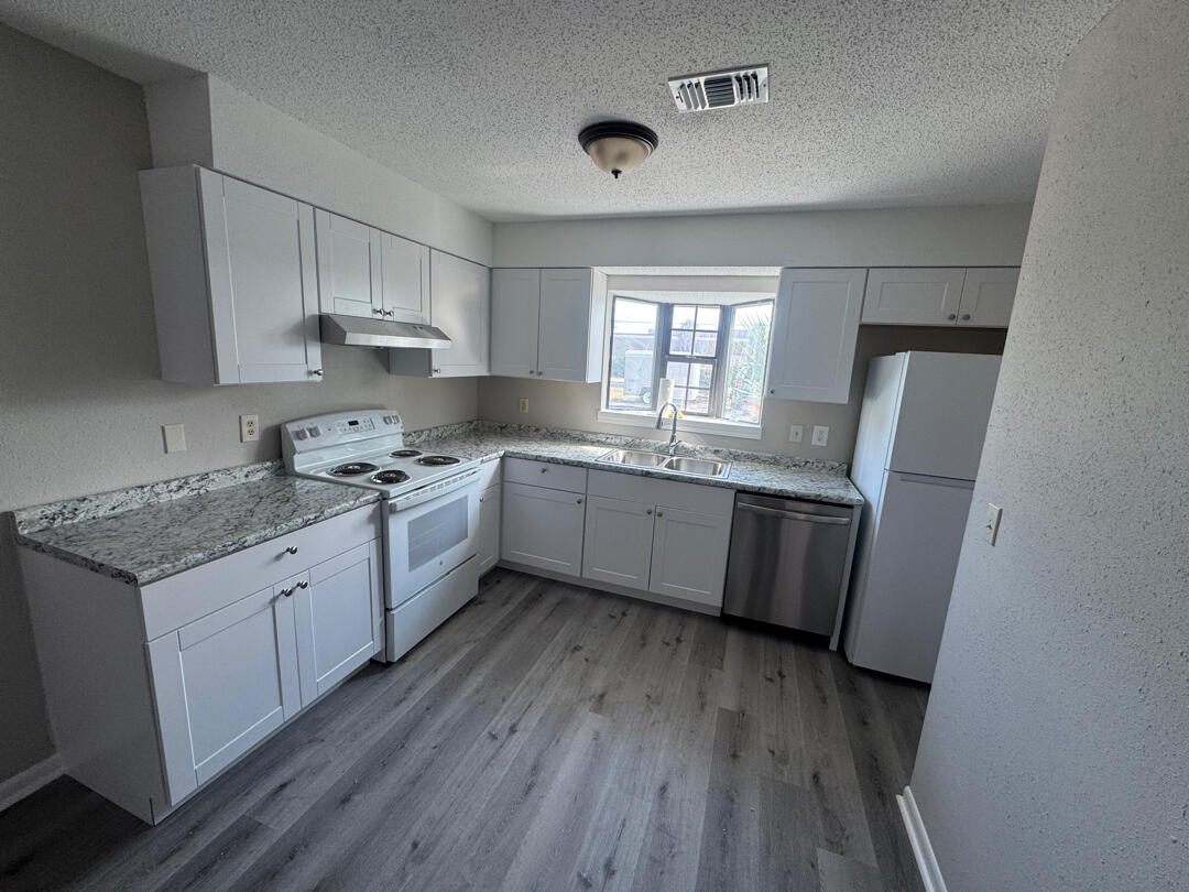 Fully renovated 2BR/1.5BA townhome located in Mary Esther near Hurlburt Field. Recent updates include new flooring throughout, brand-new kitchen cabinets, countertops, vanities, fresh interior paint, and all new appliances. The main level features the living room, kitchen, and half bath. Both bedrooms and a full shared bath are located upstairs. Washer and dryer hookups in unit. Conveniently situated next to the Santa Rosa Mall and just minutes from Hurlburt Field, shopping, dining, and schools. Move-in ready and ideal for military