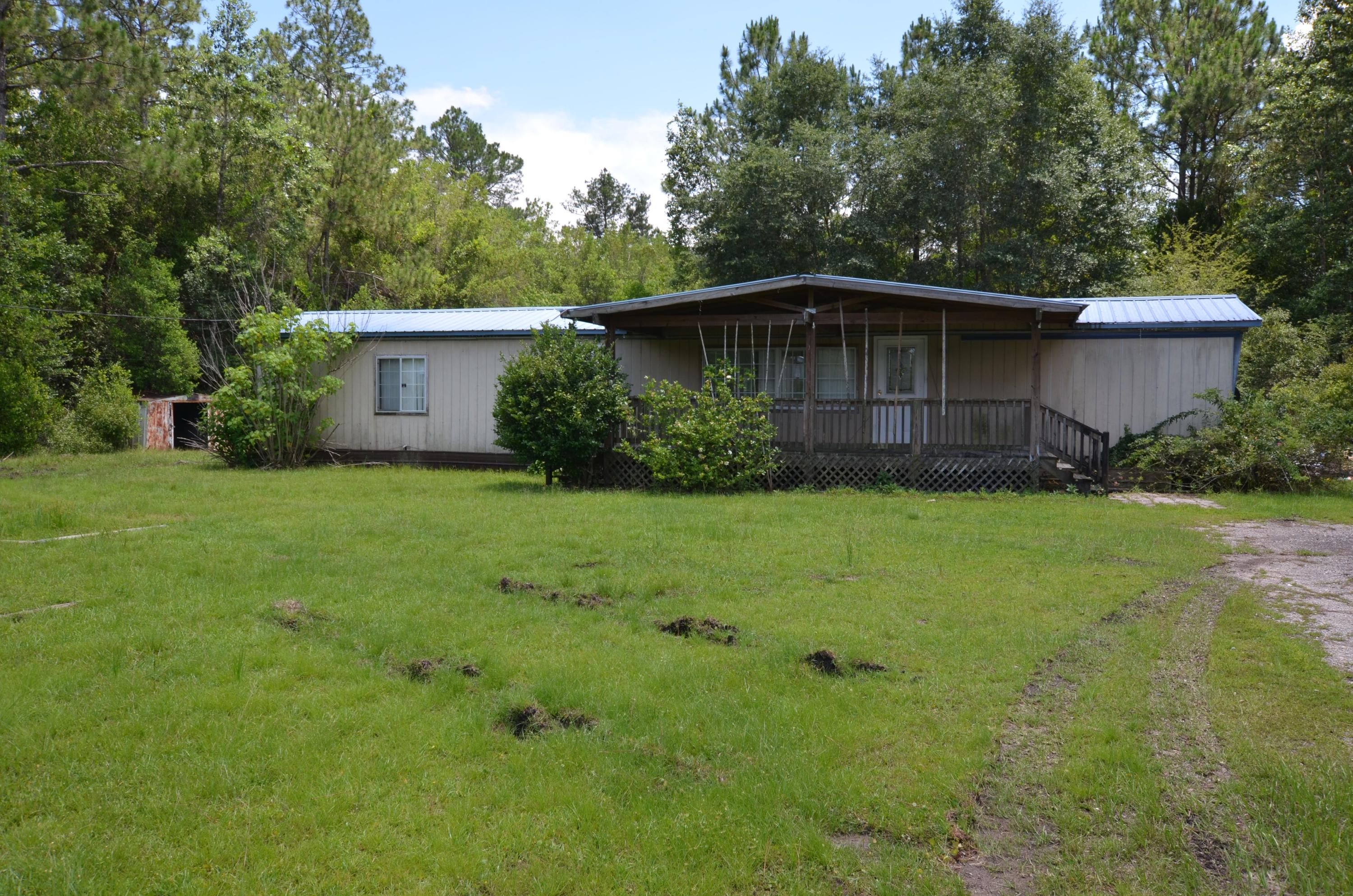This REO mobile home was built in 1988 and comes with 2 bedrooms and 2 baths. Home has had some modifications and an additional sunroom is added to rear of the property. Large covered porch in the front and several buildings for storage. Priced to sell and based on condition.