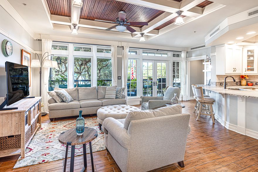 Luxury lakefront and location blend perfectly in this stunning craftsman style condo end unit. Overlooking Lake Powell, Florida's largest coastal dune lake in gated Wild Heron just minutes away from the Gulf of Mexico. There is meticulous attention to detail in every design decision of this spacious three bedroom, three bathroom  condo. Custom features that are handpicked include a stunning center island breakfast bar with leathered texture; stainless appliances; viking gas stove; dry bar with wine refrigerator; beautiful custom cabinetry; a large walk-in pantry with butler's sink and custom shelving; permanent grill; and front-end washer and dryer.  The large dining room and spacious living room are perfect for entertaining. In addition, the tile throughout shows like hardwood with tongue and groove coffered ceilings in the main living area.
It is easy to lose yourself with the lake views as your make your way to the primary bedroom suite with southwestern views. The primary bedroom suite is a retreat with French doors that open up to a private balcony overlooking Lake Powell. The primary bathroom suite offers double vanities, a luxurious jetted tub, a steam room and shower combo, ample custom cabinetry and a large walk-in closet. There are two guest bedrooms with two additional baths that offer plenty of room and privacy in a split plan. 
Lakeside Lodge condos are hidden gems located within Wild Heron, which is a gated community, surrounded by the Sharks Tooth gold course, a Greg Norman designed masterpiece. There are two other golf courses including Watersound, and a new 18 hole golf course with Watersound memberships available offering additional amenities. Parking is conveniently located underneath the building for easy access and the condo is on the first floor, so you only have to go up one flight of stairs to get to the condo. 
Wild Heron has world-class amenities which including: 24 hour security and gated access, walking trails to Watersound Origins, two pools, hot tubs, fitness center, boathouse with canoes and kayaks for residents to use, a covered picnic area with fireplace, and a fire pit with seating. This complex offers it's own private pool and library.
You are a short drive to the Gulf of Mexico, Pier Park, Lake Powell Park, 30Avenue for shopping  and entertainment, Camp Helen State Park, and Rosemary or Alys Beach.