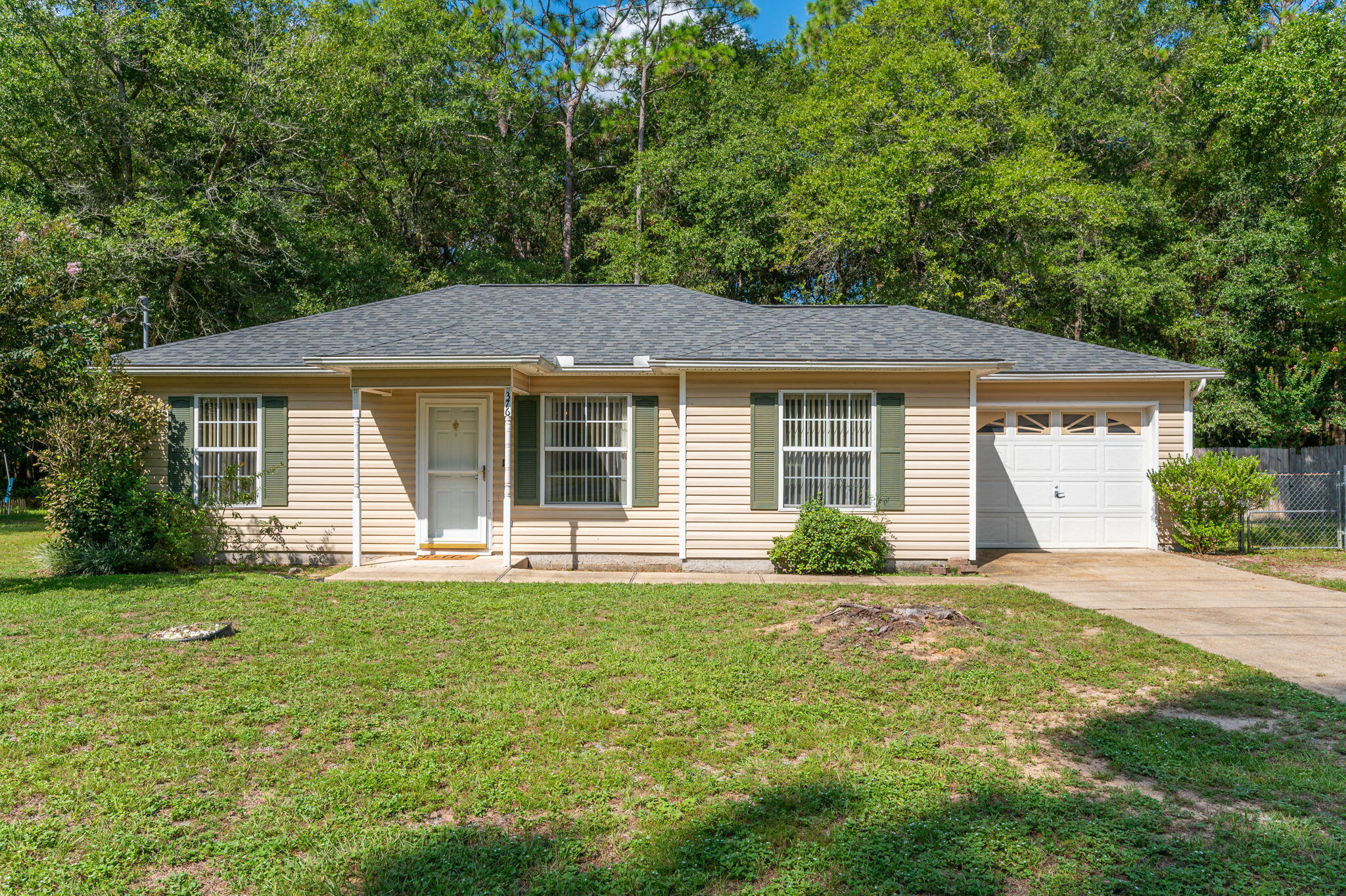 Charming 3 bedroom, 2 bath home with a garage! This property is centrally located in Crestview and features new wood laminate flooring in the main areas, vaulted ceilings, glass top stove/oven, and ceiling fans throughout! Neutral colored walls and floor plan will make you want to relax at home. Property features a one car garage, covered back porch, and fully fenced backyard!