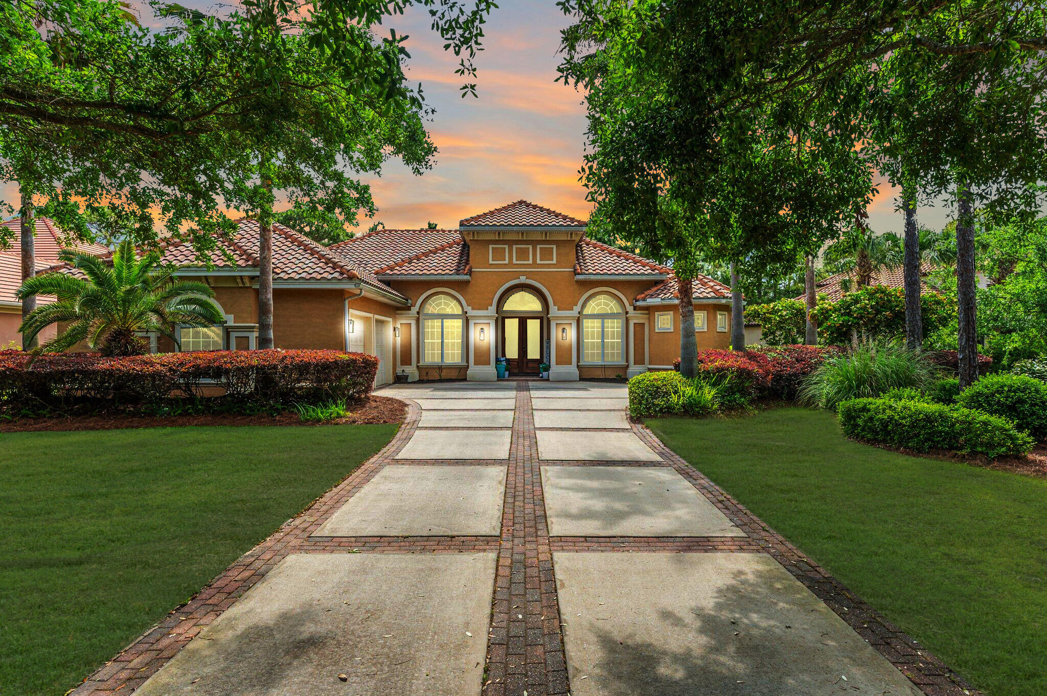 Luxurious family living all on one level in the esteemed gated golf community of Regatta Bay. This 5-bedroom lakefront home is carefully planned with large family gathering spaces as well as areas for privacy including two home offices and a separate formal living room. The screen-in lanai overlooking the lake ties the whole home together through multiple access points throughout. The kitchen holds the hallmarks of a gourmet kitchen: granite countertops, stainless steel appliances, gas cooktop, wine refrigerator, warming drawer, generous workspace, breakfast bar, and center island. The master suite is a peaceful respite with lake views, private office, two closets, and an inviting master bath with separate granite topped vanities, garden tub, and large walk-in shower.