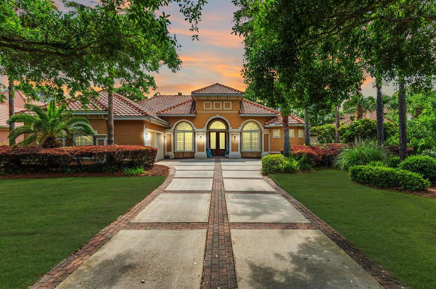 Luxurious family living all on one level in the esteemed gated golf community of Regatta Bay. This 5-bedroom lakefront home is carefully planned with large family gathering spaces as well as areas for privacy including two home offices and a separate formal living room. The screen-in lanai overlooking the lake ties the whole home together through multiple access points throughout. The kitchen holds the hallmarks of a gourmet kitchen: granite countertops, stainless steel appliances, gas cooktop, wine refrigerator, warming drawer, generous workspace, breakfast bar, and center island. The master suite is a peaceful respite with lake views, private office, two closets, and an inviting master bath with separate granite topped vanities, garden tub, and large walk-in shower.