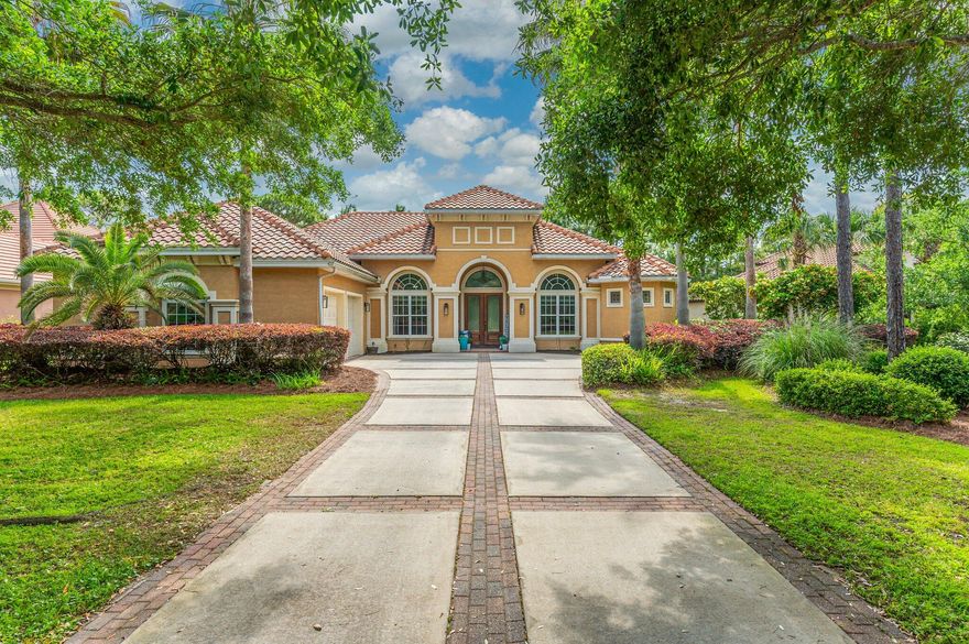Luxurious family living all on one level in the esteemed gated golf community of Regatta Bay. This 5-bedroom lakefront home is carefully planned with large family gathering spaces as well as areas for privacy including two home offices and a separate formal living room. The screen-in lanai overlooking the lake ties the whole home together through multiple access points throughout. The kitchen holds the hallmarks of a gourmet kitchen: granite countertops, stainless steel appliances, gas cooktop, wine refrigerator, warming drawer, generous workspace, breakfast bar, and center island. The master suite is a peaceful respite with lake views, private office, two closets, and an inviting master bath with separate granite topped vanities, garden tub, and large walk-in shower.