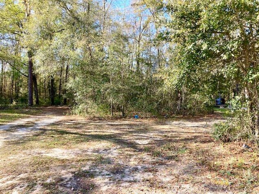 Hard to find level lot within the City of DeFuniak Springs.  Located in a quiet established neighborhood this partially cleared 1/3rd acre lot has power and City water and sewer located on the paved street, but a tap fee would be due for the water meter and sewer connection, and also a fee for the power pole from FPL.