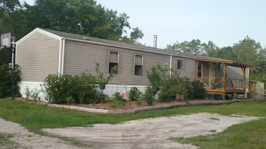 If you want COUNTRY? Man! do I have a place for you. Over 20 acres with a 1350 sq ft Mobile, new pole barn, pond, and complete garden. If you want privacy, this is as good as it gets. Unlimited possibilities with room to stretch out and enjoy Florida nature. Be the first to get this great deal on this very desirable property.