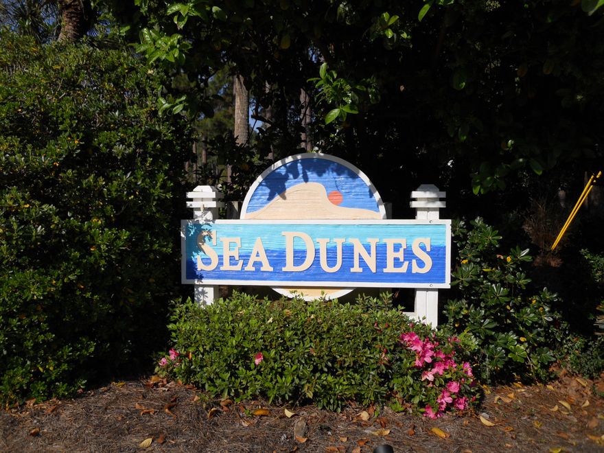 THIS IS A FANTASTIC LOT!!!! One of the few lots left in Sea Dunes that backs up to the commons and State preserve land. No homes will be built behind this private lot. Lot has Oaks and natural Pines and magnolia. DO NOT LET THIS ONE SLIP BY!!Survey done within the last 60 Days. Lot is in zone X and no Flood Insurance required. AGENT/OWNER
