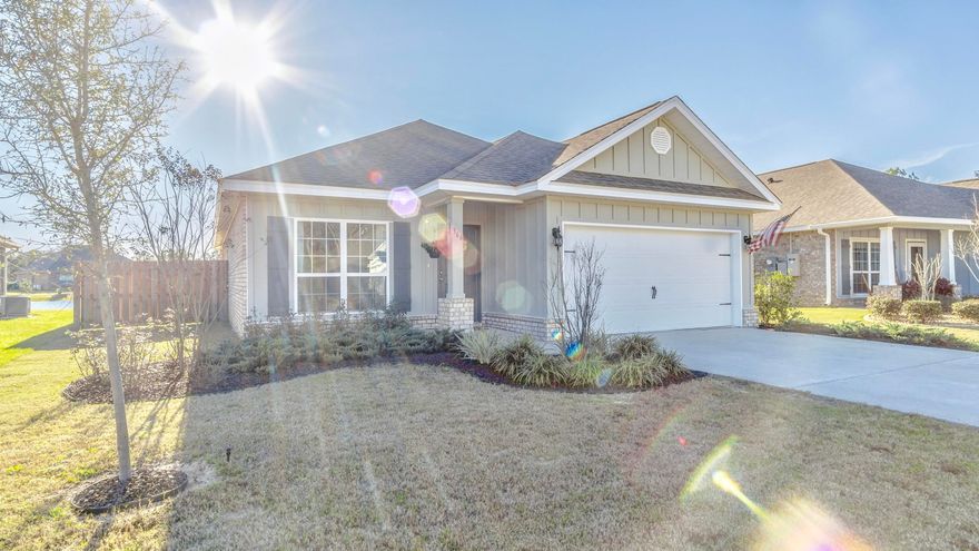 Welcome home to this beautiful waterfront Oakley floor plan inside Passages of Hammock Bay. This immaculate 3 bedroom, 2 bath home needs to be on your MUST SEE list. With new hardwood tile floors, shiplap accent walls in the guest bedroom, office with glass french doors, beautiful granite counter tops in the kitchen, storage shelves installed in the garage, lots of floored space in the attic, completely fenced in back yard overlooking the neighborhood pond, and rubber mulch gardens outside. Enjoy sensational waterfront sunsets from your back porch, master bedroom, or living room. Located in the prestigious area of Hammock Bay, a 3,000-acre bay front master-planned residential community nestled in the quiet surroundings of Freeport, Florida. Hammock Bay has all the first-class amenities
