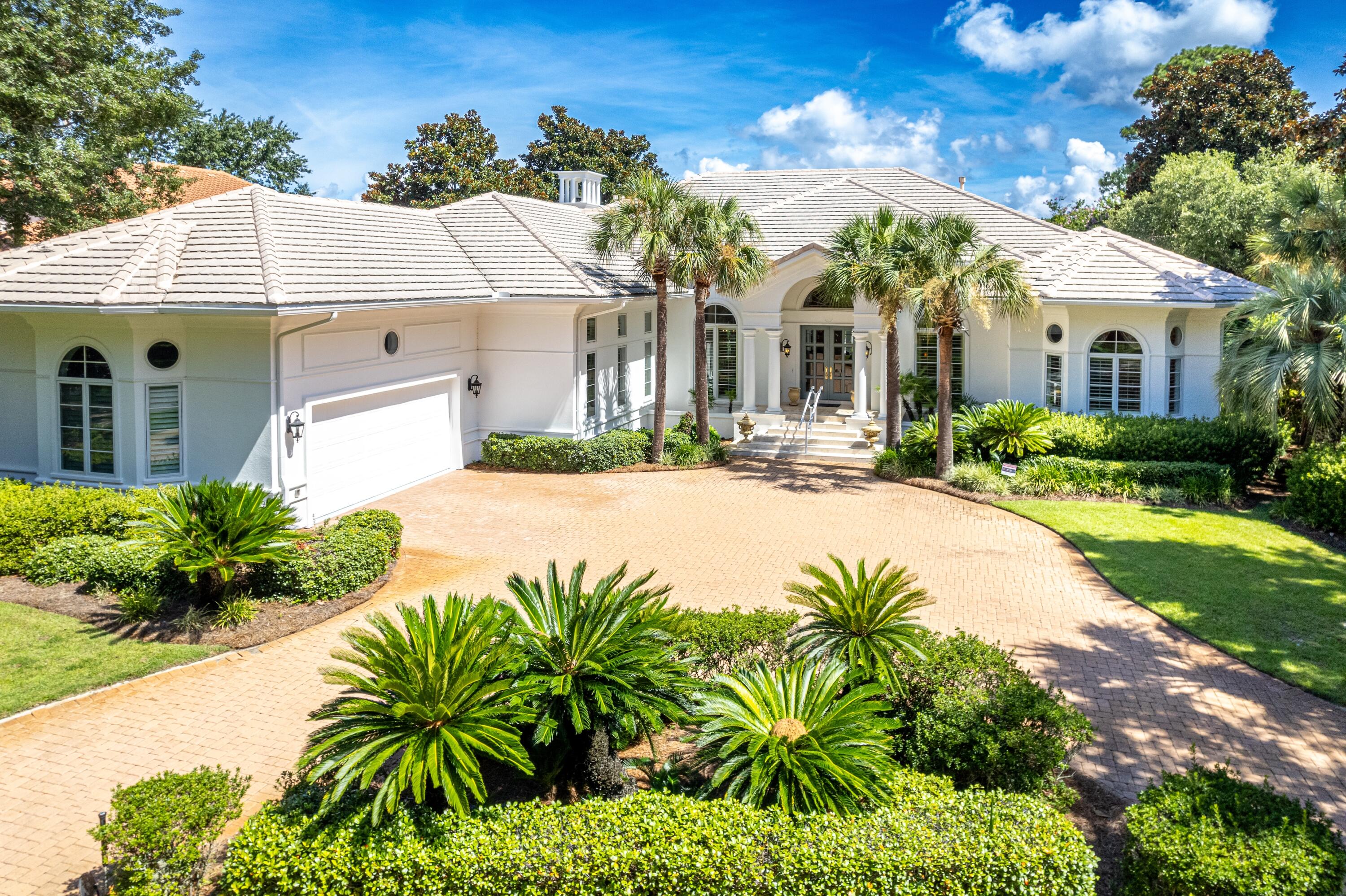 Refined Single-Level Living with Poolside Perfection and Golf Course Views in the heart of Burnt Pine at Sandestin. Experience this exquisite Palladian-inspired estate, ideally positioned along the 10th fairway of the renowned Burnt Pine Golf Course with sweeping lake views. Designed for both comfort and elegance, this single-story home showcases a stunning octagonal porch leading to a private pool and waterfall spa--your own backyard retreat. Inside, the thoughtfully designed layout features four spacious bedrooms each with en-suite baths, a powder room, dedicated office, two living areas, formal dining room, and a cozy breakfast nook. Soaring 18-ft ceilings, plantation shutters, Italian marble flooring, and Hickory hardwood in all bedrooms create a luxurious yet timeless aesthetic. The remodeled gourmet kitchen is a chef's dream with quartz countertops, a tiled backsplash, an entertainer's island with gas cooktop, a new Bosch dishwasher, and a Kitchenaid trash compactor. Additional upgrades include dual new gas water heaters (2022), new HVAC systems (2018 & 2020), a 2022 whole-home A/V system with surround sound and music, and fresh paint throughout the exterior and garage (2024).
As an introduction to the Sandestin lifestyle, we invite our new owners to explore amenities that make Sandestin special. The listing brokerage and seller(s) are presenting the buyer(s) of this property with (2) 90-minute rounds of Tennis court time, a golf foursome at one of our three championship courses, and a round of golf for up to four (4) players at the unrivaled Burnt Pine Golf Club.
Sandestin Golf and Beach Resort features more than seven miles of beaches and pristine bay front, four championship golf courses, 15 world-class tennis courts, a 226-slip marina, a fitness center, spa and celebrity chef dining. Shop, dine and play at the charming pedestrian village, The Village of Baytowne Wharf and more. Inside the gates of the resort, residents enjoy a balanced lifestyle of high-class living, spanning the 2,400 acres from the beach to the bay. Everything within the gates of the resort is accessible by golf cart or bicycle. The entire resort is interconnected by miles of pedestrian, bike and golf cart paths that weave through groves of live oaks, meandering past natural lagoons, fountains, man-made lakes, and meticulously landscaped fairways.