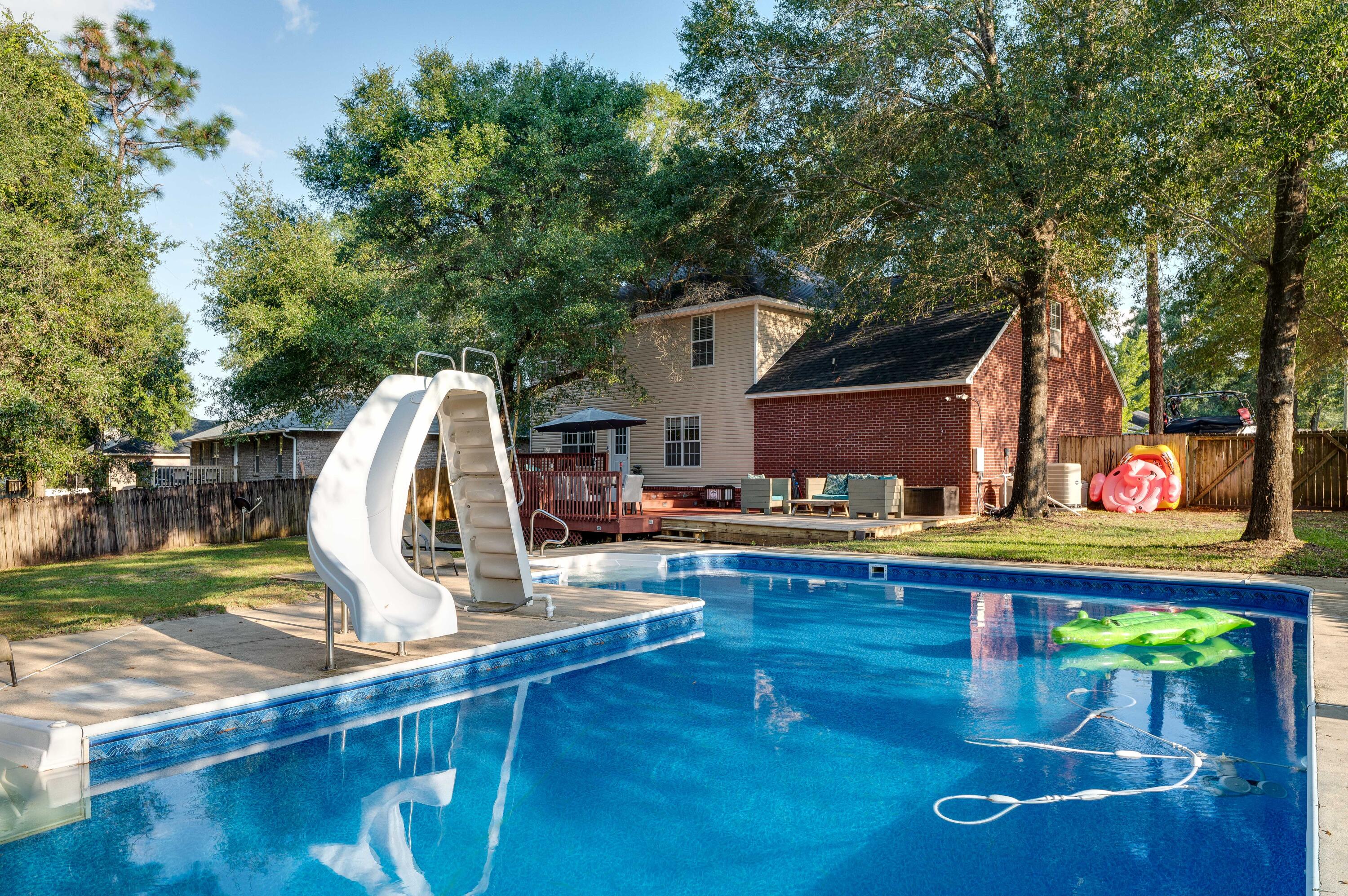 ATTENTION VA BUYERS.. THIS POOL HOME HAS AN ASSUMABLE 2.8% INTEREST RATE ON A VA MORTGAGE! 2-STORY COLONIAL WITH MASSIVE INGROUND POOL.. NOW AVAILABLE.. AND THIS ONE COMES WITH $64,000-PLUS IN UPGRADES! New roof! New Pool Liner! New flooring!In fact, this 4 BR/3 bath brick beauty also comes with new lighting.. new fixtures.. and all 3 bathrooms received a facelift! The kitchen boasts MAHOGANY CABINETRY.. black appliance suite.. and a spacious designated CAFE SPACE! There's also an adjoining FORMAL DINING ROOM. The upstairs plays host to all 4 bedrooms.. VERY LARGE BEDROOMS.. particularly the master suite.(Continued)