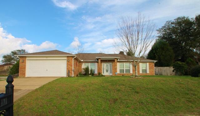 Immaculate all brick property in EXCELLENT condition with a great location south of I-10! FRESH INTERIOR PAINT! 2042 square foot split bedroom plan featuring 3 bedrooms, 2 full baths and a study that could double as a bedroom. Formal dining room plus a spacious breakfast room with a bay window! Lots of beautiful cabinets in the kitchen. Solid surface counter tops. Stainless steel appliances include a really nice refrigerator! Smooth surface range and microwave range hood. Large pantry. Huge multi-level deck in the back yard for entertaining. Built in grill and a fire pit! Double car garage. Like new carpet. Security system. Indoor laundry room. Nice landscaping. Westview is a popular location because of the proximity to the military installations, medical facilities, and shopping.