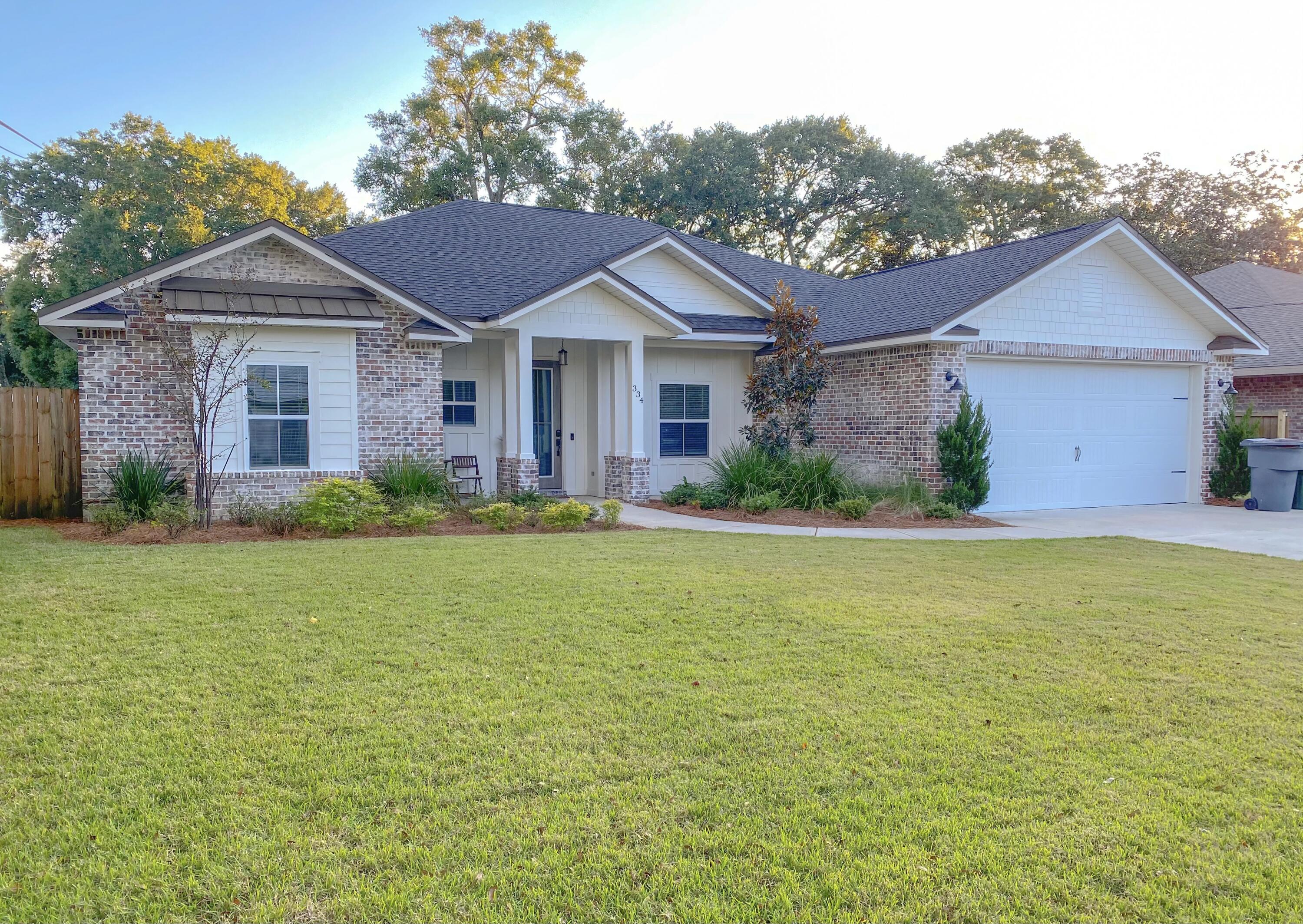 Beautiful craftsman style home located in highly sought after downtown fwb. This home is located in a golf cart friendly neighborhood and has everything you're looking for and more! 10 minutes from Destin and just 5 minutes from beaches. This is a 4 bedroom 3 bathroom home. Pull up into your oversized driveway/garage and immediately feel at home. Both front and back porches have tongue and groove ceilings. Upon entering into the home the office is on the right, with gorgeous full glass doors. Continue into the living area with custom shiplap wood burning fire place. Boasting an open floor plan, the kitchen is directly off the main living area, perfect for entertaining. The kitchen has all name brand stainless steel appliances, 5 burner gas stove, fridge with ice maker and freezer, level 3 granite countertops and a beverage center with mini wine fridge. Off the kitchen is a large laundry room complete with Maytag washer and dryer. Master bedroom has tray ceilings and glass door to back yard. Master bathroom is a dream. Freestanding oversized soaking tub and HUGE custom tile shower complete with bench hand held sprayer and rain head. His and her vanities with make-up counter on the right. The large covered back porch overlooks the backyard which has custom landscaping and zoysia sod. Tv hook up and Pavered fire pit make it the ideal spot to grill out and watch the game. Home has luxury vinyl plank flooring, 8' doors through out, impact glass on all windows and exterior doors, craftsman style interior trim, termite bond, soffit flood lights around the perimeter of the home, automatic irrigation system with well and tankless gas water heater.