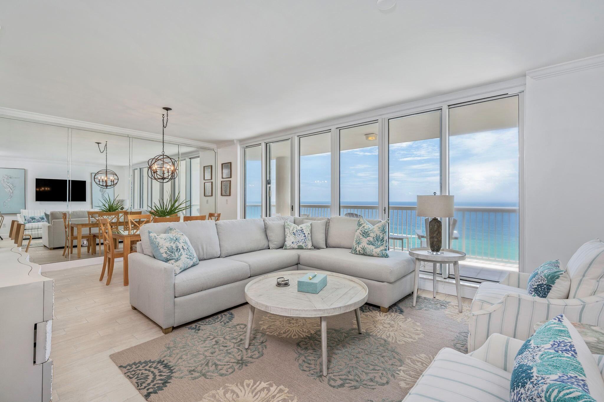 Recently Fully Renovated in 2022 and new luxury furnishings and decor from Risa's Interiors and Stock & Trade just arrived. Mesmerizing 180 degree beach views east and west from the 14th floor of this luxurious 3 bedroom 3 full bath condominium in the highly sought after Silver Beach Towers. An entire wall of floor to ceiling windows provide nothing but water views from the living room, dining room, kitchen and master suite. You will love the fresh clean look of the brand new wood looking tile floors throughout every room including the closets.Completely new kitchen features granite countertops, glass tile backsplash, breakfast bar, brand new stainless steel appliances with smooth top range and white shaker soft close cabinets & drawers. The primary suite offers.. Click Here to READ