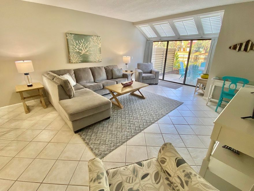 Enjoy the gorgeous lake view from this beautifully decorated  2 bedroom, 2 1/2 bath villa located on the beach side of Sandestin Resort with all its amenities.  You will love the kitchen with it's  Stainless Steel appliances and bright window looking out onto the entrance courtyard.  The living area has a new comfy sectional and a big flat screen TV .    The master bedroom has a king bed plus a wall of windows looking out onto the lake.  It has a private bath with a  shower.  The  2nd bedroom has 2 twin beds with its own private bath also.   This  townhome is across from the pool and a short sidewalk stroll to the beach.    Make sure you call to view this lovely beach villa before it is gone.