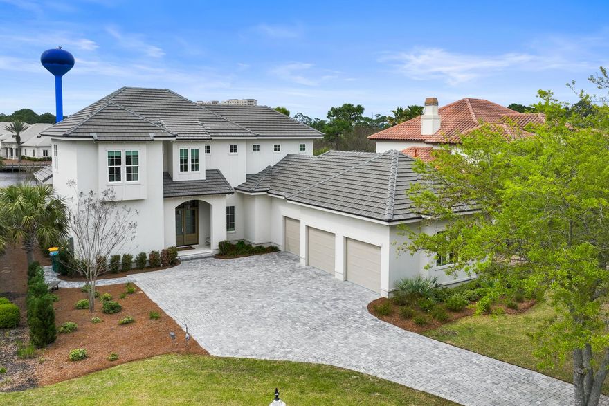 Beautifully constructed in 2021 by Legendary Home Builders, 298 Corinthian Pl. has everything you want and need! This quality-built luxury home offers an extended kitchen/dining/living open floor plan- perfect for entertaining and relaxing. The gourmet chef's kitchen features TWO large islands, Wolf & Subzero appliances, wall to wall custom cabinetry and a large walk-in pantry. The Master Suite, which is located on the 1st floor, offers views of the outdoor living space including the lake and the Award-Winning Regatta Bay Golf Course! The spacious master bath features a separate walk-in custom tiled shower, a large soaker tub, separate his & her vanities, and a huge his & her walk-in closet with access to the laundry room!