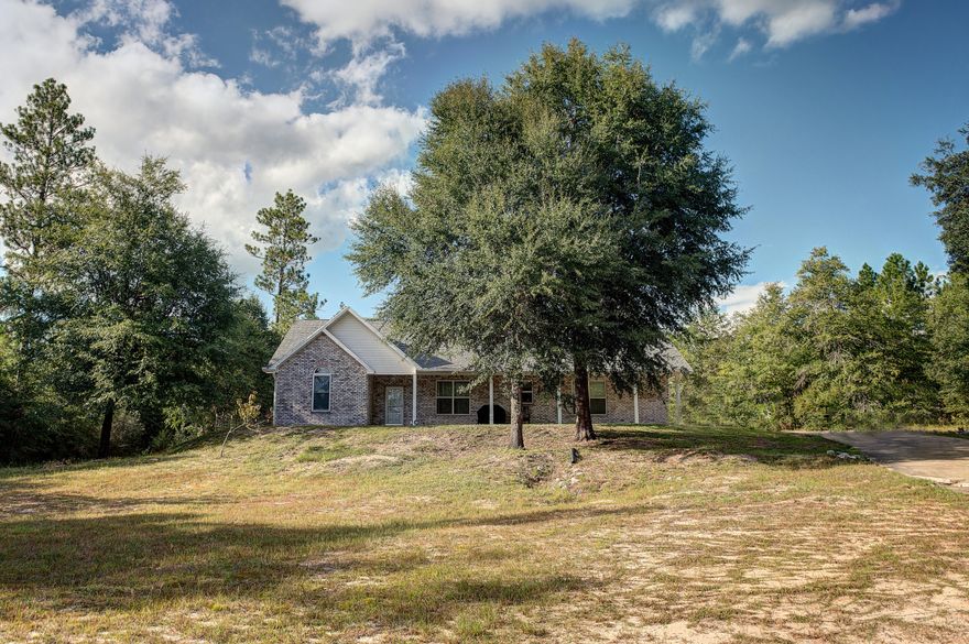 Country living at it's best! This gorgeous 7.28 acre property delivers all the perks of rural life, while being minutes away from the high school and all the best that the town of Crestview has to offer! The picturesque property is partially cleared and sits back from the road down a 1/4 mile long driveway. Beautiful home near the rear property line, giving a peaceful view of acres of privacy in the front yard. Front property line runs along a creek, the perfect spot for a morning walk or evening stroll. The wooded acreage to the rear and sides of home offer primo privacy-no need to worry about being bothered by neighbors here. The home is a terrific blend of modern (built in 2005) and rustic touches. Please click ''MORE'' to read more information about the interior of this lovely home!