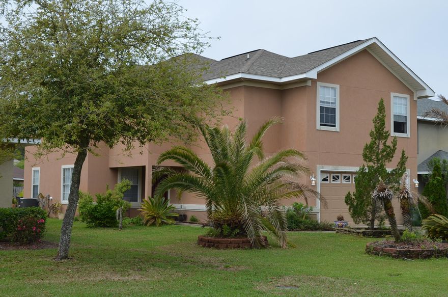 If you are looking for a great family neighborhood with low HOA fees, look no more. Beautiful 4 bedroom (or 3 bedroom and office) has Travertine floors, wine bar with fridge and a soaring 2 story living area. The kitchen has solid surface counter tops, stainless steel appliances, large bar and opens to the living area. The large master bedroom has a tray ceiling and there is a jetted tub and walk in shower. All bedrooms have walk-in closets. Warm designer colors make this home inviting. Community pool in neighborhood and the bay is only a block away. Away from it all yet close to the beach, Sandestin and world famous 30A.