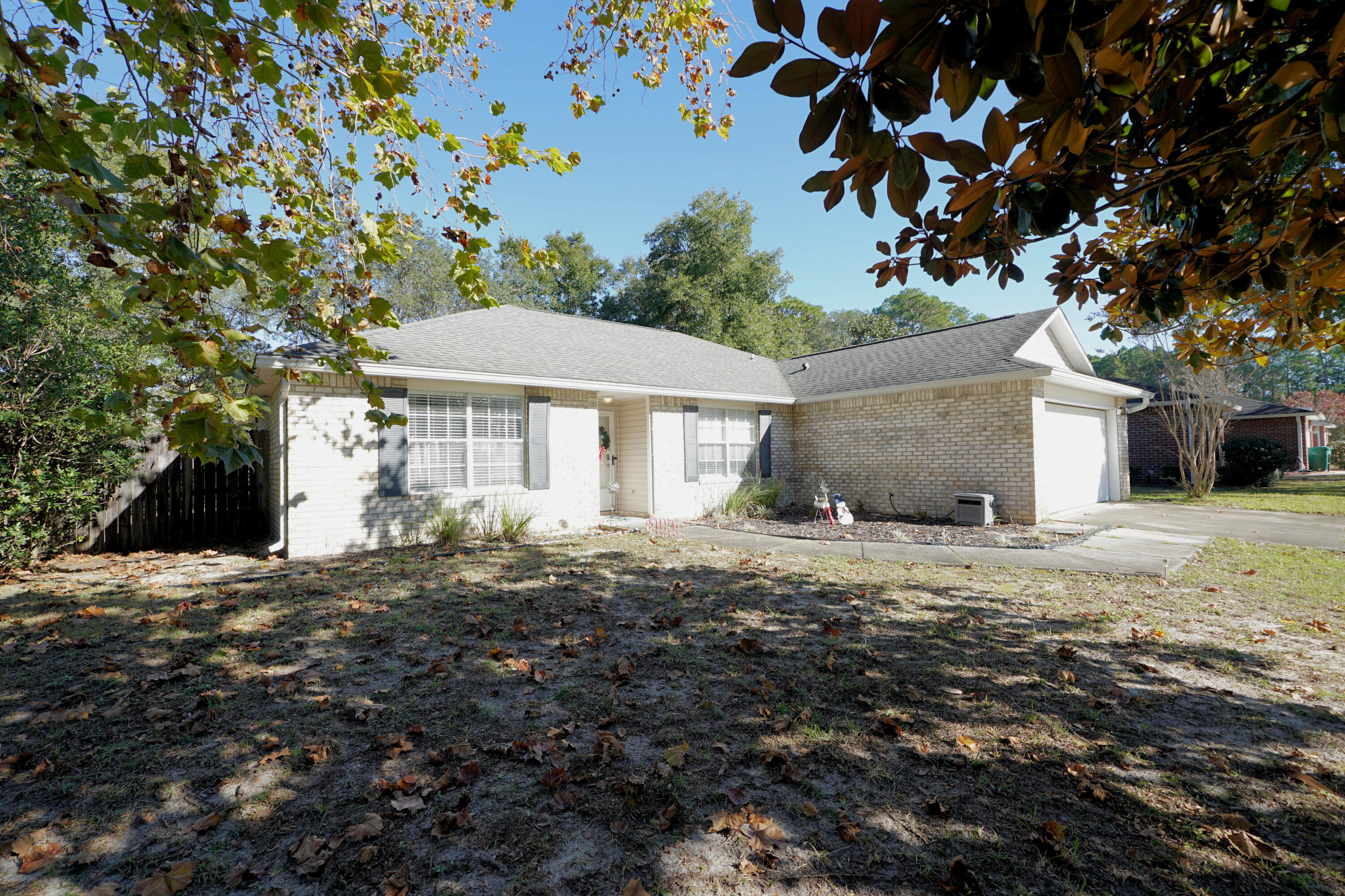 This charming brick home in the peaceful Shadow Oaks subdivision is perfectly situated for easy access to all your needs. The property features raised ceilings, dark walnut laminate flooring in living areas and tile in wet areas, a cozy fireplace, a split floor plan, and a fenced backyard. The spacious eat-in kitchen has stainless steel appliances and a convenient island.Notable updates for the home include kitchen appliances from 2014, a roof installed in 2016, HVAC     ????, and water heater ????