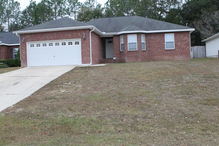 COMFORT + PRACTICALITY= I LOVE IT! This home blends the right ingredients to create a most desirable living experience. Laminate & tile flooring throughout, beautiful accents w/chair rails & lovely lighting fixtures add that perfect touch. Super large pantry/laundry room off the kitchen. Formal dining that can be used as an office if you prefer. Open living area w/wood burning fireplace says home sweet home! Spacious Master has trey ceilings & master bath w double vanities and separate shower. French doors open to the tiled screened enclosed patio for those days you want to spend in the fresh air. Yard is fenced and level. This home is move in ready! Make this one yours!!!