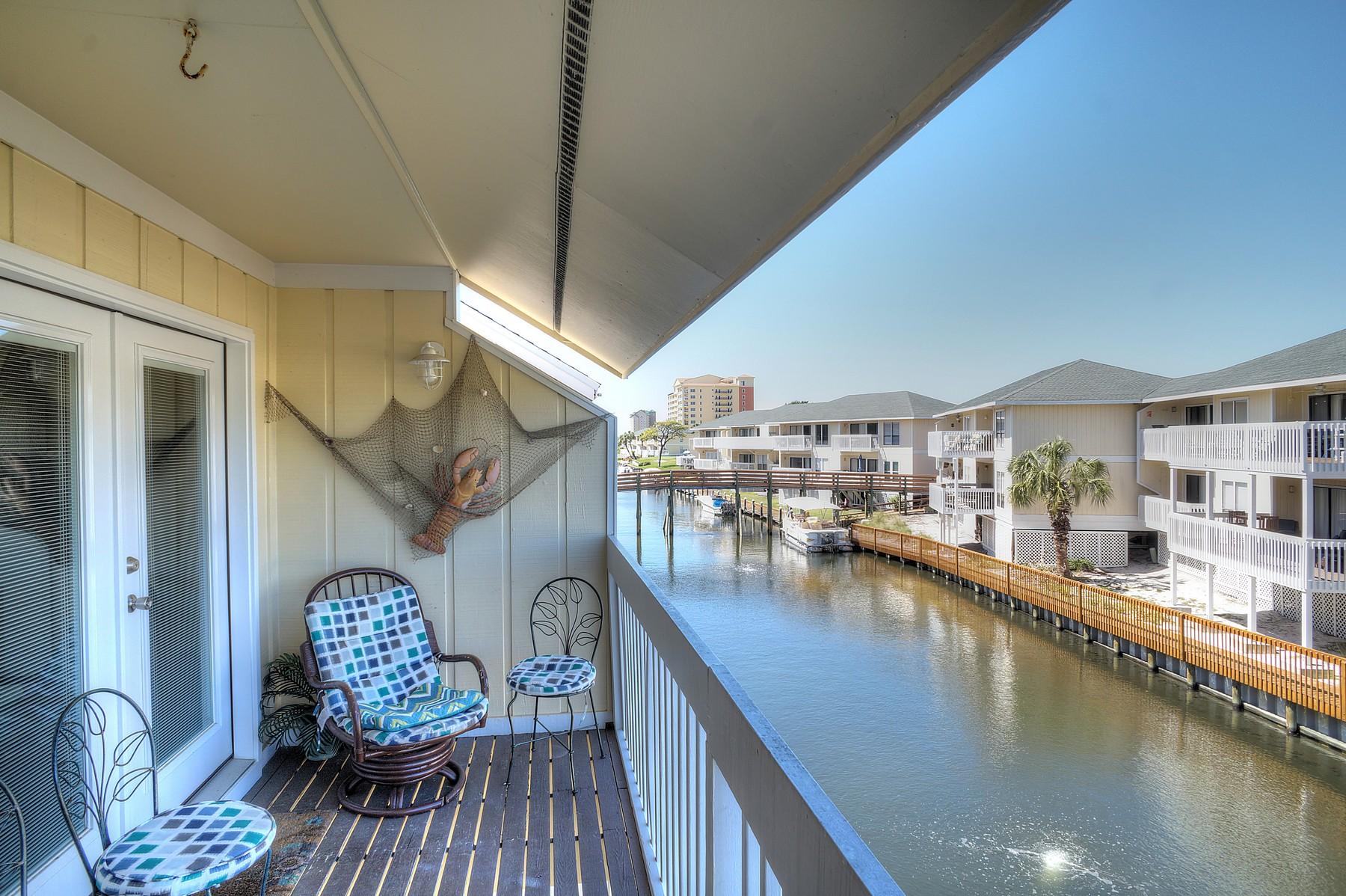 Escape from it all as you sit on this second-level balcony and enjoy the refreshing gulf breezes. This attractively-priced two-bedroom condo overlooks both the Sandpiper golf course and the boat canal that opens into Destin Harbor. Beautifully decorated in bright beach colors, this condo is a great place to vacation or live and offers the flexibility of being a turnkey rental unit as well. The roomy master suite has its own bathroom and a separate lavatory/sitting area. The cheerfully-appointed second bedroom has two sets of bunk beds and sleeps up to five since one of the bottom bunks provides a full size mattress. The hallway bathroom with a tub/shower is just a few steps away. The spacious living area offers a sleeper sofa and a dining table that accommodates six people.