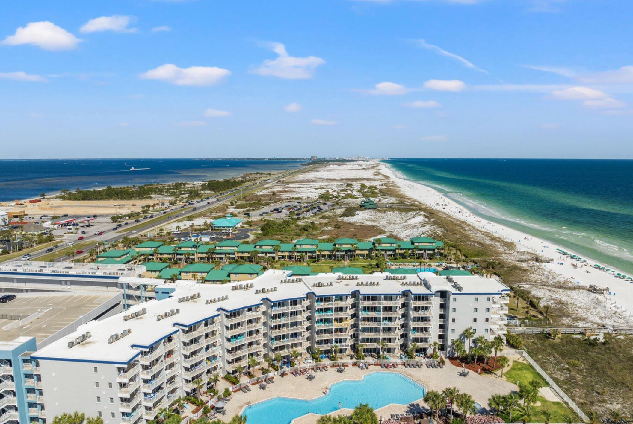 Enjoy direct Gulf views and a steady stream of income from unit 205. This fully furnished condo overlooks the Gulf of Mexico, beachfront pool & hot tub, kid's wading pool, fitness center, beach boardwalk and grassy grounds. Unit 205 is essentially a 2 bedroom unit, and is located on the second floor of Destin West's Gulfside Building, which has easy access to the walkover bridge. The bay-side amenities include the lazy river, zero-entry pool, heated pool with waterfall, and community hot tubs. Destin West Gulfside 205 has an open-concept floor plan that's ideal for spending time with family and friends. The living area is comfortably arranged and boasts a sleeper sofa, flat-screen TV, and entrance to the private furnished balcony. The master bedroom is furnished with a king bed, flat-screen TV, and ensuite master bathroom. The master bathroom has a full-sized tub with a shower. The nearby bunk area has two twin beds a TV and a connecting guest bathroom. The guest bathroom has a large walk-in shower. Each room has been thoughtfully and stylishly arranged to offer you and your guests a comfortable, relaxing, and refreshing beach vacation. Upgrades include: 2022 HVAC system, luxury vinyl flooring, Brand new TV's, new decor & kitchen upgrades. Rental potential $45k-$65k a year, wow!