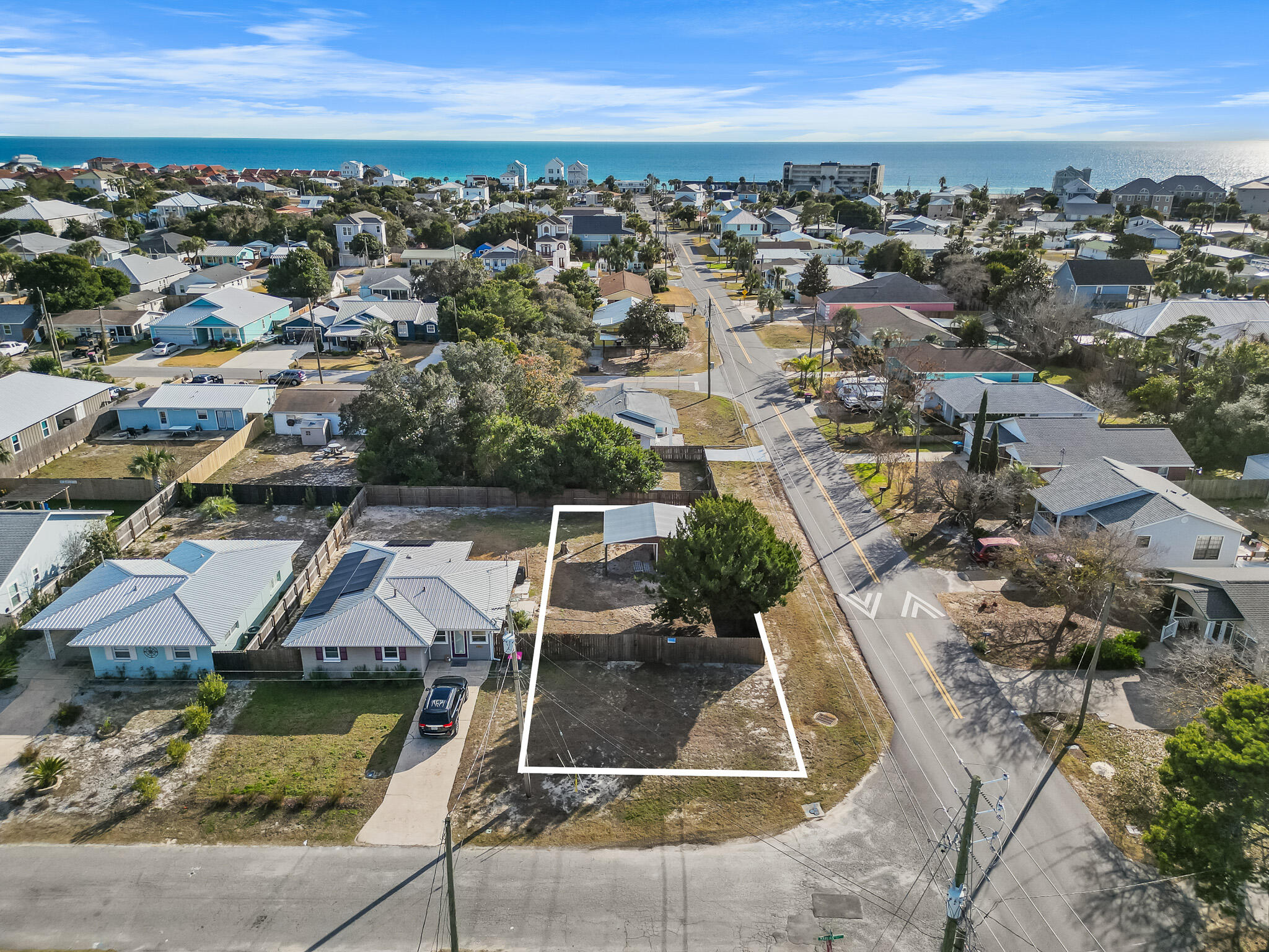 Looking for the perfect opportunity to build your dream beach retreat? This prime corner lot at Kelly St. and Marlin Ave. on the sought-after West End of Panama City Beach is just 0.4 miles from two public beach access points--Access 87 & Access 88--offering easy access to fantastic beaches. With no HOA fees, you can create your ideal coastal cottage. The West End is experiencing exciting new developments, making this location a smart investment for those looking to be part of a growing community. Quiet beaches, multiple access points, a golf-cart-friendly community, and a laid-back atmosphere make this lot an exceptional find. Contact me today for more details! The sale includes an empty storage building, providing additional space for your beach gear or future plans. Don't miss this chance to build your sandcastle.

The home site is adjacent to this empty lot at 21823 and will be listed for sale separately if you have been looking for a double-lot opportunity. If you have been looking for a double-lot opportunity, you can utilize the existing cottage, maximize your outdoor living space on this empty lot, demo the home, and build your beach retreat across both lots.