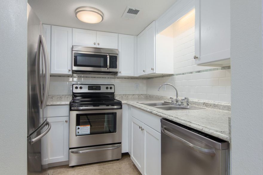 Second story unit in waterfront gated condo community. Unit features two bedrooms and one full bath. Kitchen has been updated with appliance and backsplash. Balcony over looks tennis courts and has a view of Shalimar yacht club. Community features tennis courts, pool and waterfront seating area overlooking the bay.