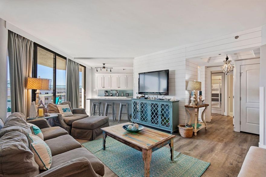 Delivering stunning gulf and beach views from all three bedrooms, this spacious condo is a popular vacation rental and grossed just under $87,000 in 2022. This well-maintained unit has updates galore including new LVP in the living spaces, newer bathroom tile and lavish white marble countertops throughout. Upgraded lighting, professional decor and stylish furnishings enhance the bright sitting area with its hand-painted artwork while the semi-open galley kitchen has a plethora of upgraded cabinets and stainless appliances. A neat breakfast bar doubles up for serving snacks and sunset margaritas while deciding where to dine. Step out onto the generous balcony with Polywood patio furniture providing a welcome space for dining, relaxing and enjoying the alluring gulf views. Wake up in one of the master bedrooms and check the cloudless skies through the clever porthole window. Step out through sliding doors directly onto the private balcony to embrace the morning tide. When guests come to visit, there's a third guest bedroom and custom-built hallway bunks provide additional sleeping for two. All three bathrooms showcase cool white marble vanities and either a shower-over-tub or a walk-in shower. Ideal as a vacation investment rental, the unit can be divided into two self-contained units, each with its own private entrance. Both sides of the lockout have updated HVAC. Onsite amenities include a communal pool, well-equipped gym, tennis and sauna along with a walkover to the nearby beach. With Topsail Hill Preserve State Park, Emerald Bay Golf Club and The Village of Baytowne Wharf nearby, the opportunities for shopping, dining and vacation activities are boundless. Dimensions are approximate and should be verified by the buyer.