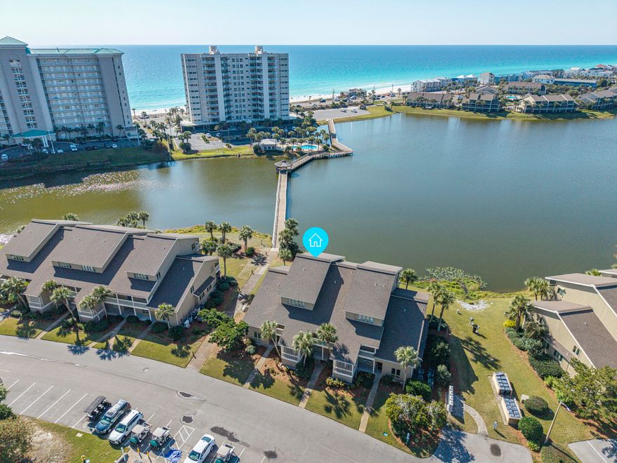 Beautiful 3-bedroom, 3-bath lakefront condo in the Boardwalk Villas, a premier location within Seascape Resort just steps from the beach. This two story unit faces southwest offering incredible sunset views over Stewart Lake and Gulf views from both levels. Enjoy not one but 2 private screened-in balconies & experience true serenity on the lake. The fully renovated interior features an open floor plan and beautiful tile flooring on the main level, completely reconfigured and updated kitchen & bathrooms and resurfaced ceilings. The added plantation shutters paired with elegant light fixtures & furniture adds to the coastal charm. This unit has never been rented and is in pristine condition. The Boardwalk Villas truly have a unique & peaceful setting, feeling more like a home than a condo! Sunsets are phenomenal over the lake and the boardwalk is just outside the door, which brings you to Seascape's designated beach with over 2,000 feet of shimmering white sands. Whale's Tail Beach Bar & Grill is across the street for seaside dining & entertainment and there is seasonal beach service and water sport rentals. Enjoy the outdoor heated pool designated specifically for Boardwalk Phase 7 including a nice pool deck, covered entertainment area, and bathrooms. This is right outside your door and is one of only two heated pools in the complex. There is also golf cart charging stations and parking spaces, which is a nice convenience and great for Scenic 98 to get to easily get to many dining options, Winn Dixie and CVS. Additional Seascape amenities include a seasonally heated pool in Tennis Village, Cabana Cafe in Ariel Dunes, tennis & pickleball courts now free for owners and guests, full basketball court, new playground, Seascape's 18-hole championship golf course and Pro Shop, bike rentals and more. Enjoy the beach lifestyle with the plentiful amenities & entertainment options at Seascape. 

The Homeowner's Association does a great job of maintaining the grounds and complex. A new roof was put on in 2017 and the exterior caulking & painting was done in 2023 along with the main balcony redone. Cable TV, internet, exterior insurance, quarterly pest control, amenities and grounds keeping are all included in your fees, making this a simple and easy investment.

The interior offers a spacious living area along with an open floor plan making entertaining easy. Tranquil lake & Gulf views are seen from both levels. The large sliding glass doors open up to a fantastic screened-in porch with durable Polywood furniture to unwind in and is a great spot for dining al' fresco. Open up the doors and relax to a fresh breeze. Enjoy outdoor dining, your morning coffee with a view, or a glass of wine at sunset. Being on the top two floors of the building you don't have to worry about noise above you and just one level down walk out to the lake where there are fish, ducks and wildlife. The upscale kitchen features custom cabinetry, stainless steel appliances, granite countertops and breakfast bar and beautiful mosaic backsplash. There is plentiful storage along with a large pantry/closet across from the kitchen. There is also a guest bedroom on the main level with an ensuite full bathroom, nicely updated with new vanity and tile to the ceiling above the tub. The upper level encompasses a spacious lakefront primary bedroom with private balcony and ensuite bathroom with double vanity and walk-in shower with glass surround. Wake up to Gulf views right from the bed! The second floor also features a large guest bedroom with a queen bed, sitting area and updated ensuite bathroom. There is a washer & dryer closet on the second level. This unit has been meticulously maintained and has never been a rental unit. ((This is the perfect second home, full time residence or vacation rental investment to enjoy the coastal lifestyle we all crave. With the newer Seascape Resort Towne Center including Acme Oyster House, a charming coffee shop, dining & entertainment, an aerial entertainment ropes course and outdoor events plaza - everything is at your fingertips! Seascape Resort is also getting a revamp soon with the golf course and there are now many events throughout the year including amazing concerts, Moon Crush and evening lantern exhibit. This is a prime time to invest as we expect continued growth here. This is the best priced 3-bedroom unit at Boardwalk Villas and with this condition and premier location, we don't expect it to last long. Do not miss out on this incredible opportunity to own on the beautiful ''Emerald Coast'' in one of Miramar Beach & Destin's finest resorts. *There are some staging decor items that are excluded but can be purchased separately. Primary bedroom furniture is also excluded (with the exception of the two chairs & TV, but will be replaced with something similar or a credit at closing). Upper guest bedroom two chairs and dresser are excluded - more details in Documents*
