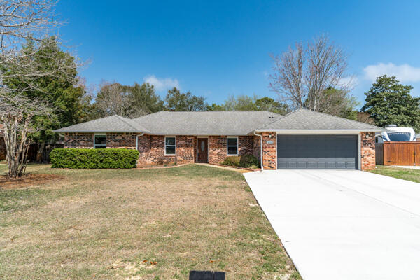 Beautiful home in sought after Raintree Estates! Situated just 2 blocks from the Bay, walk down to see the wildlife while taking in the water view at the park. As you walk into the foyer, the living space greets you with warmth from the fireplace to the high ceilings. The kitchen is open & inviting as you relax with friends & family at the breakfast bar. Off the kitchen is the very large master bedroom with ensuite giving privacy from the other bedrooms at the other side of the home. Evenings are peaceful and relaxing as you step out onto the large screened Florida room where you will see beautiful Azalea bushes spread across the entire back yard. Long updated list to include new windows & both bath updates. Make this your home today as it will not last long!