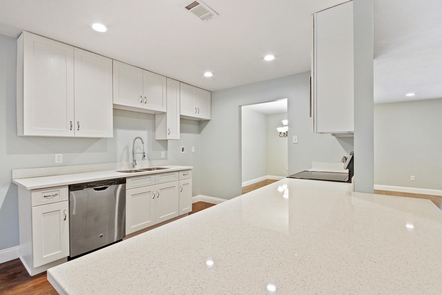 Wonderfully remodeled 4 bedroom, 2 bathroom home on nearly a full acre lot. **Seller offering HOME WARRANTY for buyer peace of mind** This home features an open floor plan and the kitchen has new WHITE SHAKER cabinets with soft close doors and drawers and QUARTZ countertops as well as brand new STAINLESS STEEL appliances. There is plenty of natural light in this home, but LED recessed can lighting has been added along with updating all lighting fixtures throughout. The living room boasts a wood burning fireplace with MODERN FARMHOUSE styling. The bedrooms are generously sized and both bathrooms have been remodeled with GRANITE and custom tile shower surround. Call today to see this home.