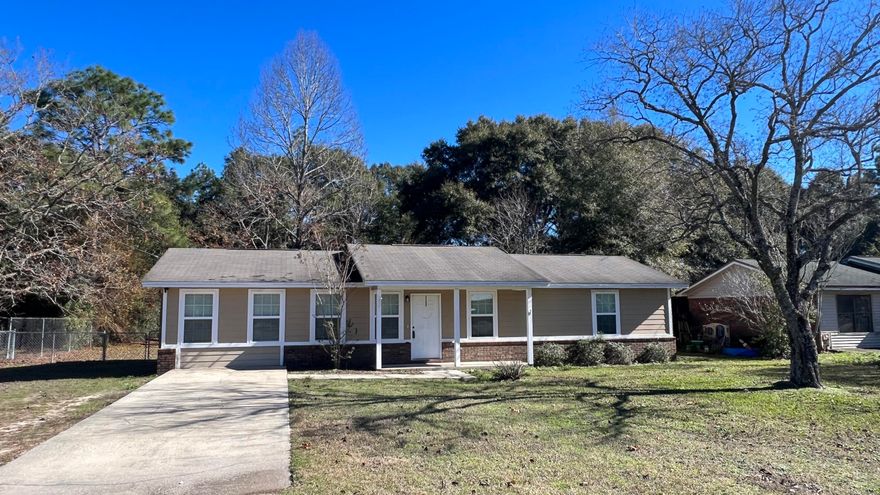 New flooring in the bedrooms and fresh paint throughout !Welcome to this charming three-bedroom, two-bathroom ranch-style home, nestled on a spacious lot. This home was recently update in the past few years.As you step inside, the oversized tile flooring guides you through the open concept living area, highlighting the functionality of the space. The kitchen boasts sleek granite countertops, offering both durability and sophistication.This home features a generously-sized laundry room, providing convenience and ample storage options. Moving outdoors, a large fenced-in backyard invites relaxation and recreation, offering privacy and security for family gatherings or peaceful moments.Conveniently situated close to schools and shopping centers. Take a look today.