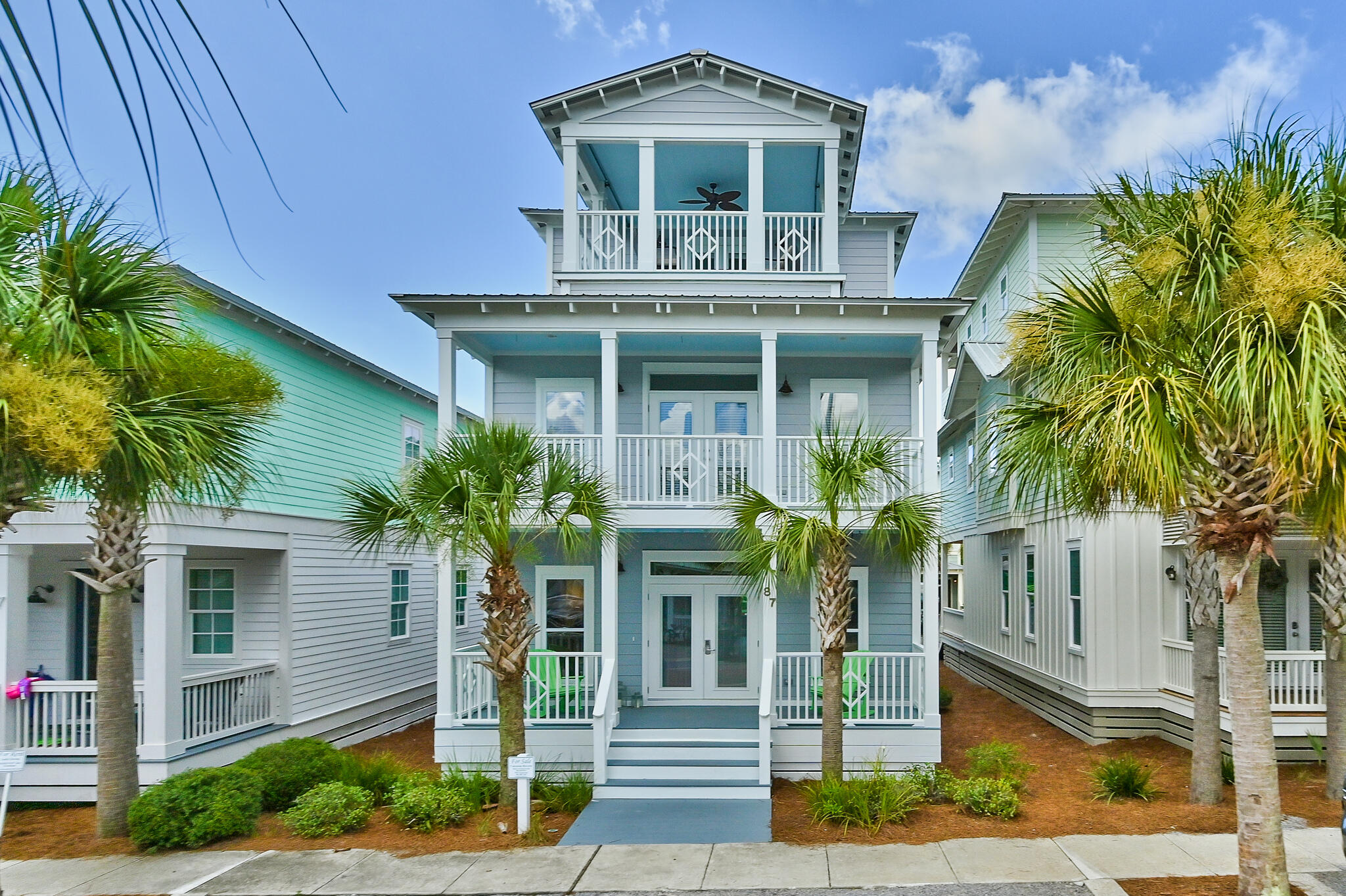 Nestled within the master planned community of Seacrest Beach, this 30A beach house spans three levels and over 2,400 square feet of thoughtfully designed living space. Upon approach the oversized porch ideal for outdoor dining and lounging leads the way to the living and dining area. The newly remodeled kitchen features ample cabinetry, a breakfast bar, and a luxury appliance suite. A bunk room with private porch and ensuite complete the first floor. Overflowing with natural light, the main suite on the second floor boasts space for a sitting area, a large walk-in closet, and a dedicated covered porch. Synonymous with relaxation, the marble adorned main ensuite encompasses a wet room with soaking tub, custom tiled shower, double vanities, and water closet.