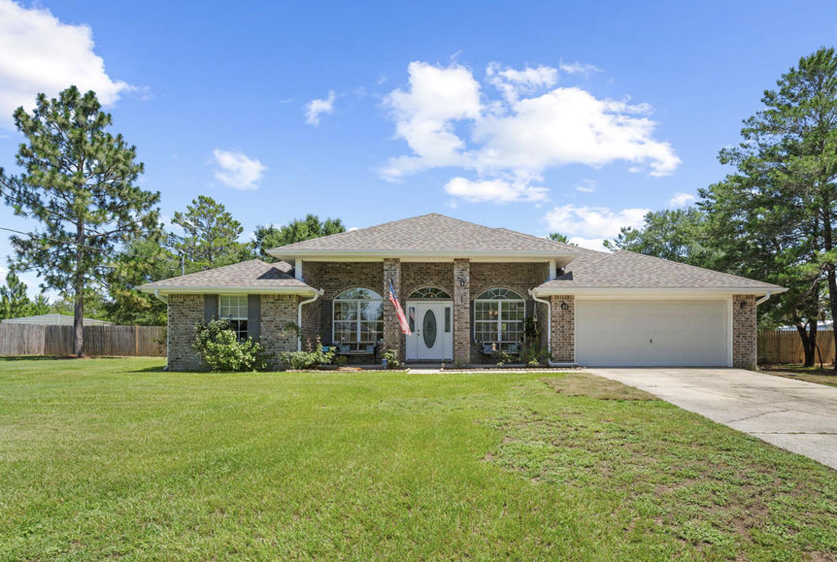 **$10,000 Closing Credit with acceptable offer**This gorgeous brick home features 4 bedrooms, 2 bathrooms, a flex room, formal dining room and cooled Florida Room. It sits on 1.03 cleared acres & comes complete with a tropical oasis out back where you can lounge around your salt water pool; it even has a huge shed out back for a man cave or she-shed!As you walk inside you'll notice the flex room to your left that's currently being used as a craft room, but would make a great office, playroom, gym or even 5th bedroom! To the right is your formal dining room! You'll appreciate the split floor plan with 3 bedrooms off to one side of the home & the master bedroom to the other side. The kitchen features stainless steel appliances, granite countertops and a seated bar area.
