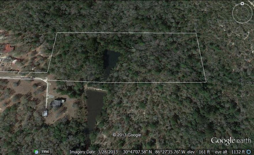 Beautiful, almost 7 acres, wooded with a 1/2 acre pond. The property is located appx 400 ft off of the road, but has a deeded 28 ft access point. The owner says the pond is spring fed, and there is an overflow pipe in the pond thru the dam. This property is pristine, with beautiful trees, an active water supply, privacy, and wildlife. The bulk of the property starts near the 3rd light pole and lies east. Boundary survey has been complete and is available for potential buyers. Drive has been cleared, so you can access bulk of property down driveway.