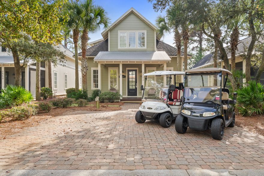 Strong rental history! Nestled beneath the palms on the Lakeside of the resort, 2452 Bungalo Lane features a spacious floor plan, designer decor, plush furnishings and an oversized screened-in porch with an extended back patio overlooking the backyard! This beautifully appointed beach bungalow offers 4 bedrooms and 4 bathrooms and is conveniently located across the street from the pool and neighborhood putting green, and a few minutes golf cart ride to the beach! This thoughtfully designed home offers the largest floor plan at Bungalos. The main level features an open concept living area and kitchen, and both a primary suite and bunk guest room on the first floor, along with two bathrooms. Upstairs features two bedrooms, two bathrooms, and a second living area!