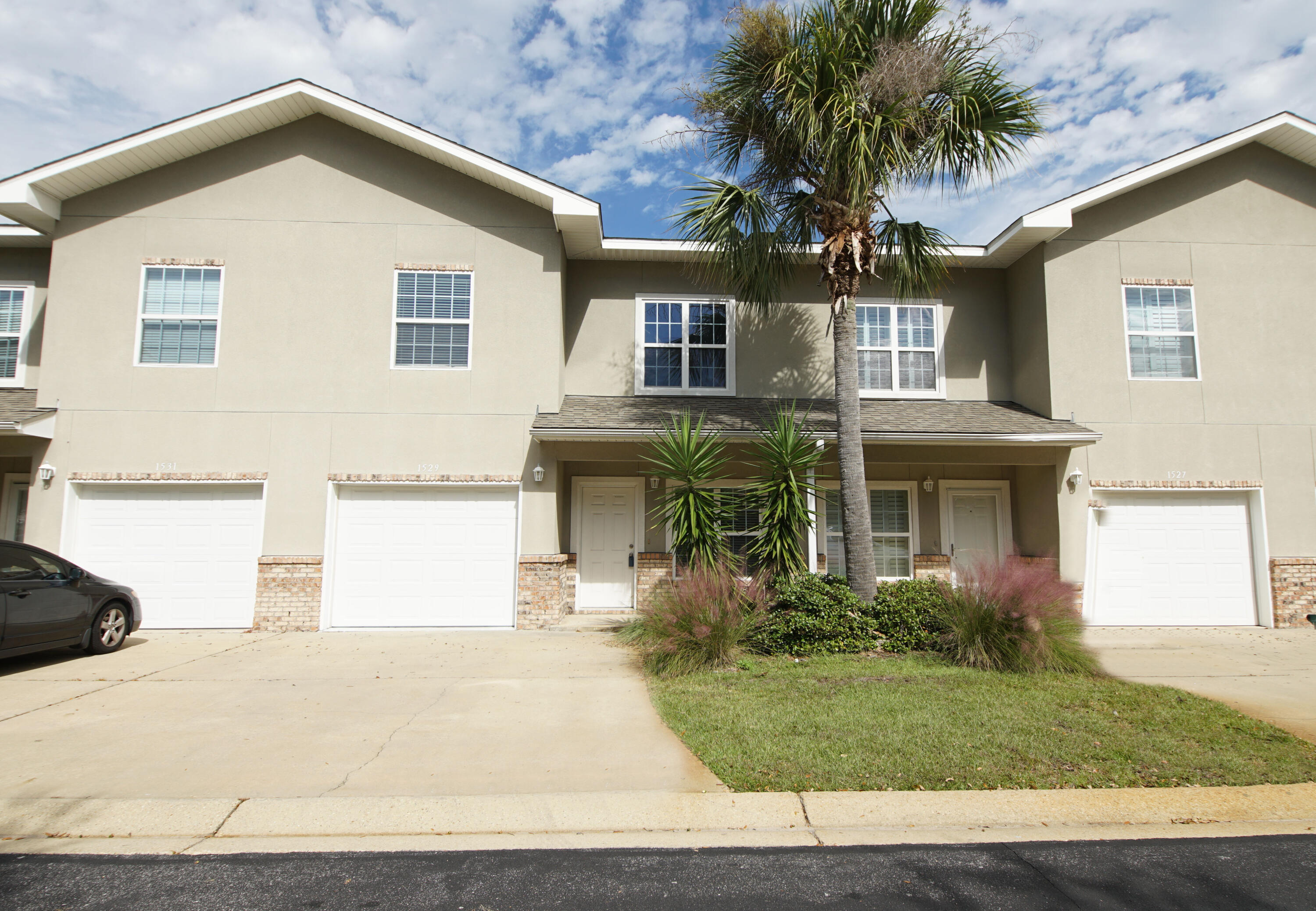 Just outside the back gate to Hurlburt Field and 9 miles from the front gate of Eglin AFB, the location of this 3 bedroom / 2.5 bathroom townhome is PERFECT for anyone stationed at either base. Plenty of PARKING- one car garage + 2 driveway spaces + guest parking right outside! High ceilings with upper windows offer amazing natural light to the Living room and Loft areas. All bedrooms are on the second floor and the spacious Loft could be an office. On the first floor is a half bath, large laundry room, living / dining room, family room and kitchen. Kitchen includes granite counter tops & all appliances.This is an excellent value and they also make great investments.