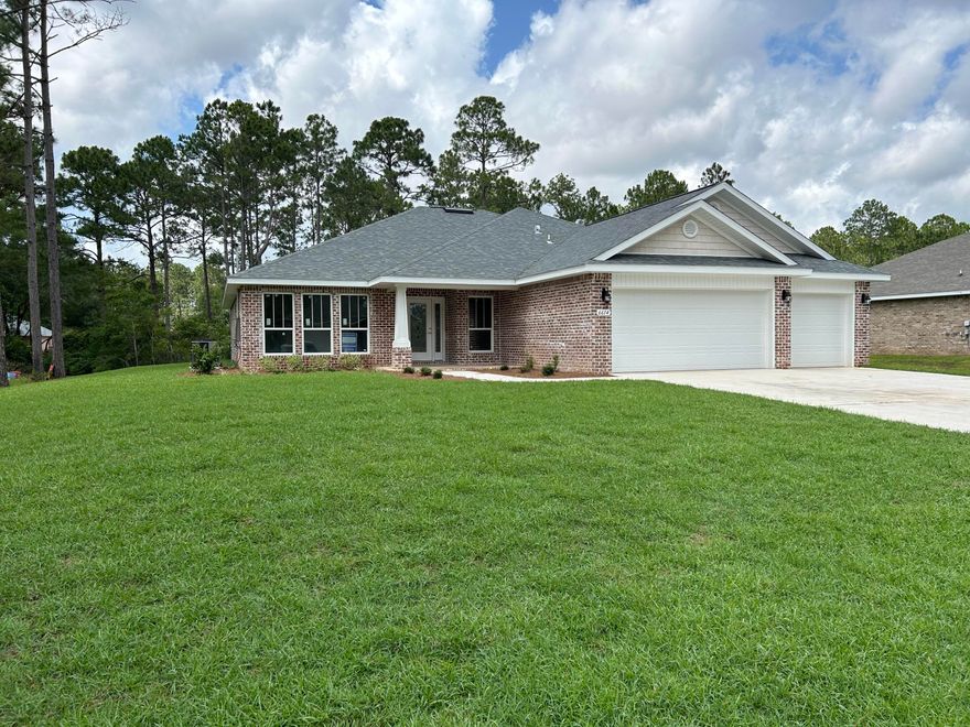 FINANCING INCENTIVE ON THIS HOME: BUILDER PAYS MOST ALL CLOSING COSTS with a Builder Preferred Lender * 4BR/3BA/3Car Garage, 1/2 acre (101x199) in the heart of Navarre *Open Concept Split Bdrm Plan * Luxury Wood Vinyl Plank in Wet Areas/Formal Areas * Family Room 10 Ft Flat Ceilings * Additional Living Area 14' x 14' * Kitchen Features: Granite Countertops, Stainless Steel Appliances, Bkfst Bar/Island & Walk in Pantry *Master Bath: Builder's Signature Zero entry Walk in Tile Shower, Tile Floor, Dbl VanIty, Separate Soaking Tub & 2 Walk-in Closets *Other Features: Breakfast Cafe, Dining & Flex Rm *Covered Rear Lanai *Irrigation, Lawn Pump & Well in Sodded Areas * 2'x6' Construction * Warranty