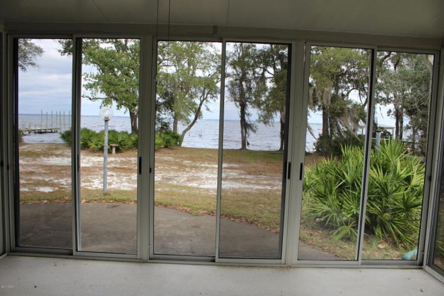 What a delightful Bay front home in Santa Rosa Beach. This home sits towards the back of a very large 100x233 lot on the Choctawhatchee Bay giving you a sense of privacy and serenity. The home has loads of windows throughout and a glassed in sunroom with 6 foot doors allowing natural light and astonishing views from the living area. There is also a screen porch off the kitchen to enjoy the views and atmosphere of Bay front living. This spacious home has plenty of room for entertaining those boating friends. The gorgeous beaches are only a short distance away via boat or car. Shopping, entertainment and restaurants are at their finest in the Destin and renowned Scenic Hwy 30A area which are close by. The location is not only breathtaking it is also convenient. Come see for yourself.